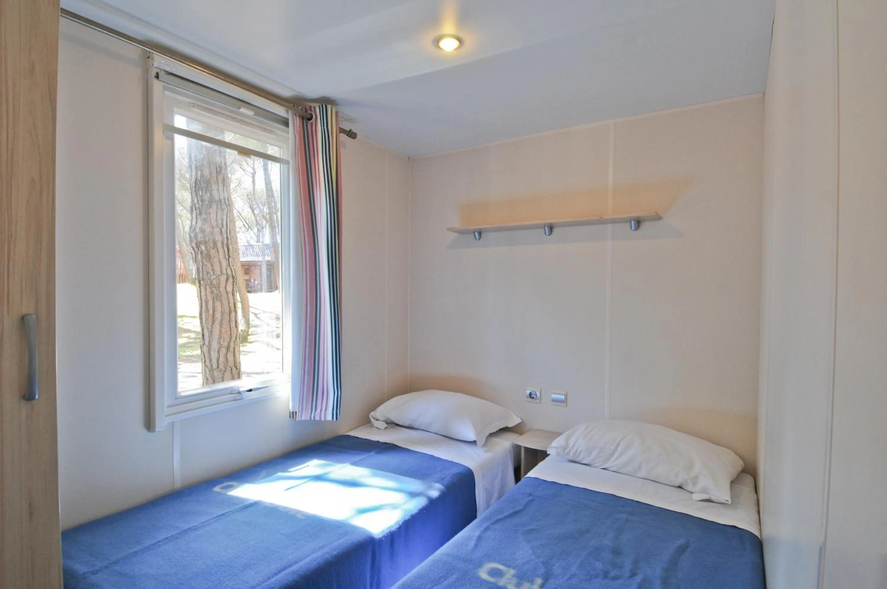 Bed in Club del Sole Spina Family Collection