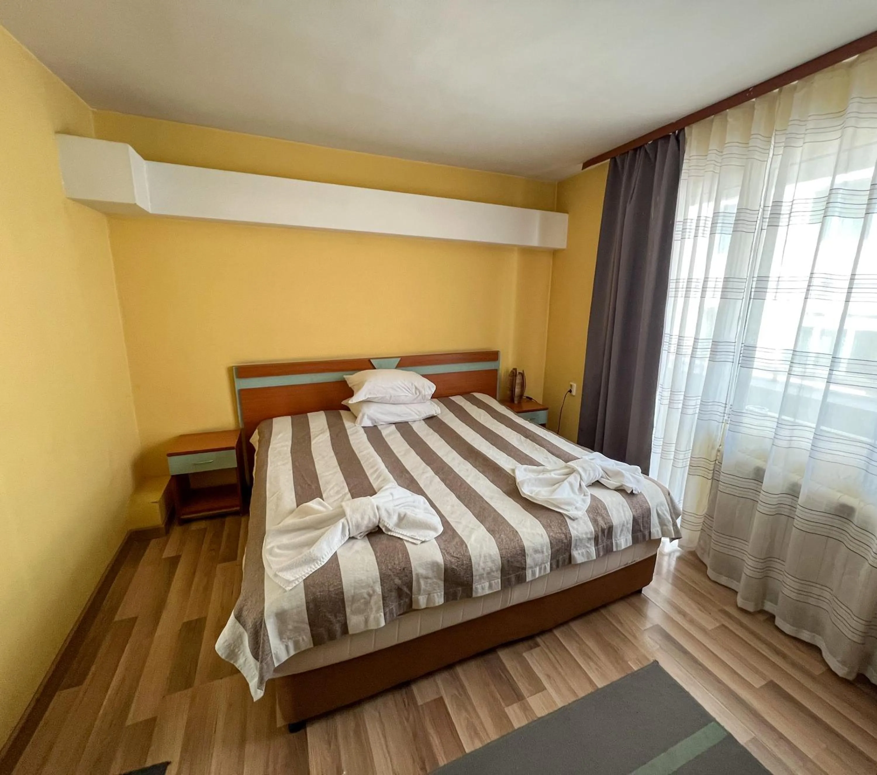 Bed in ALPHA family HOTEL