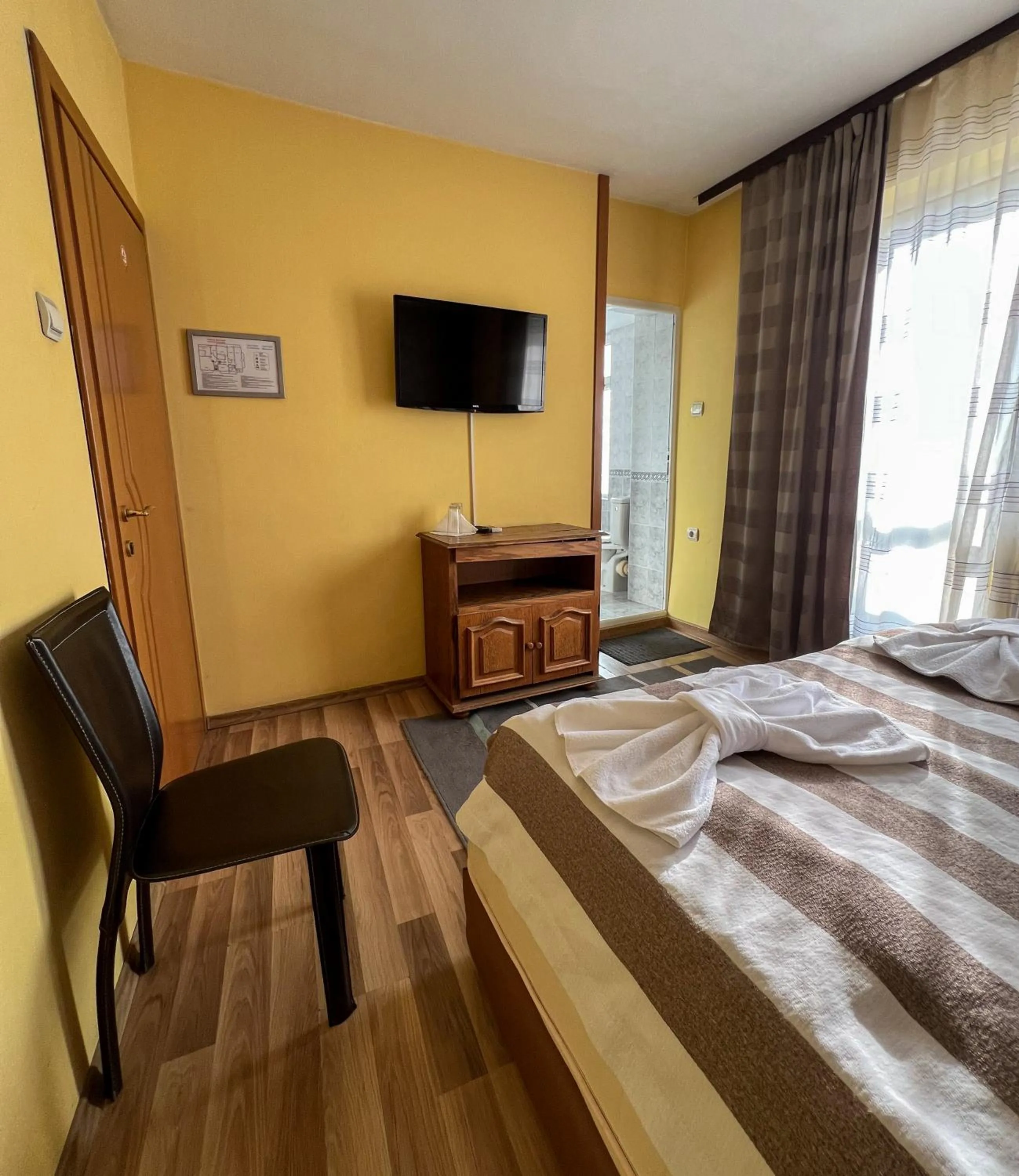 Bed in ALPHA family HOTEL