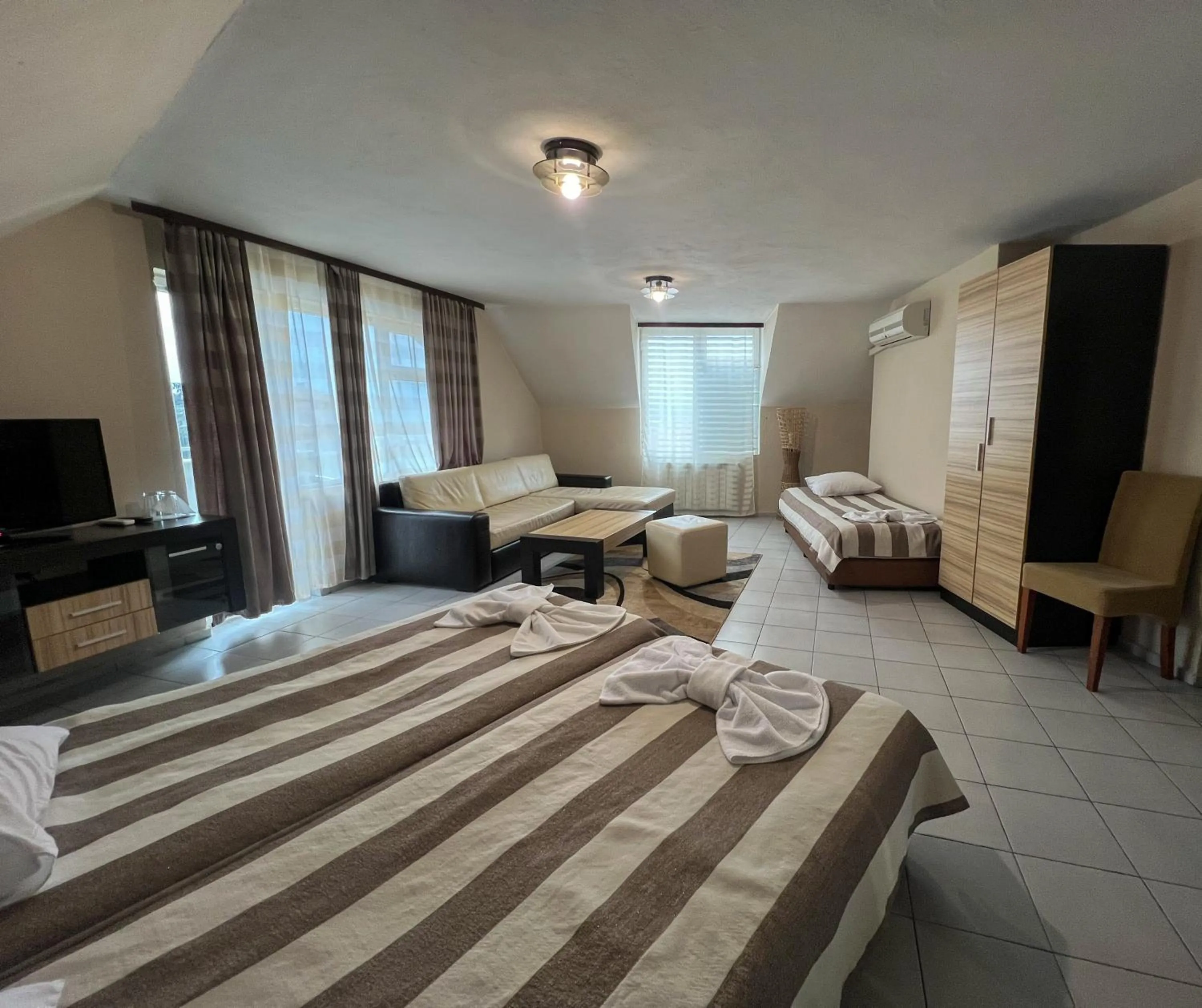 Bed in ALPHA family HOTEL