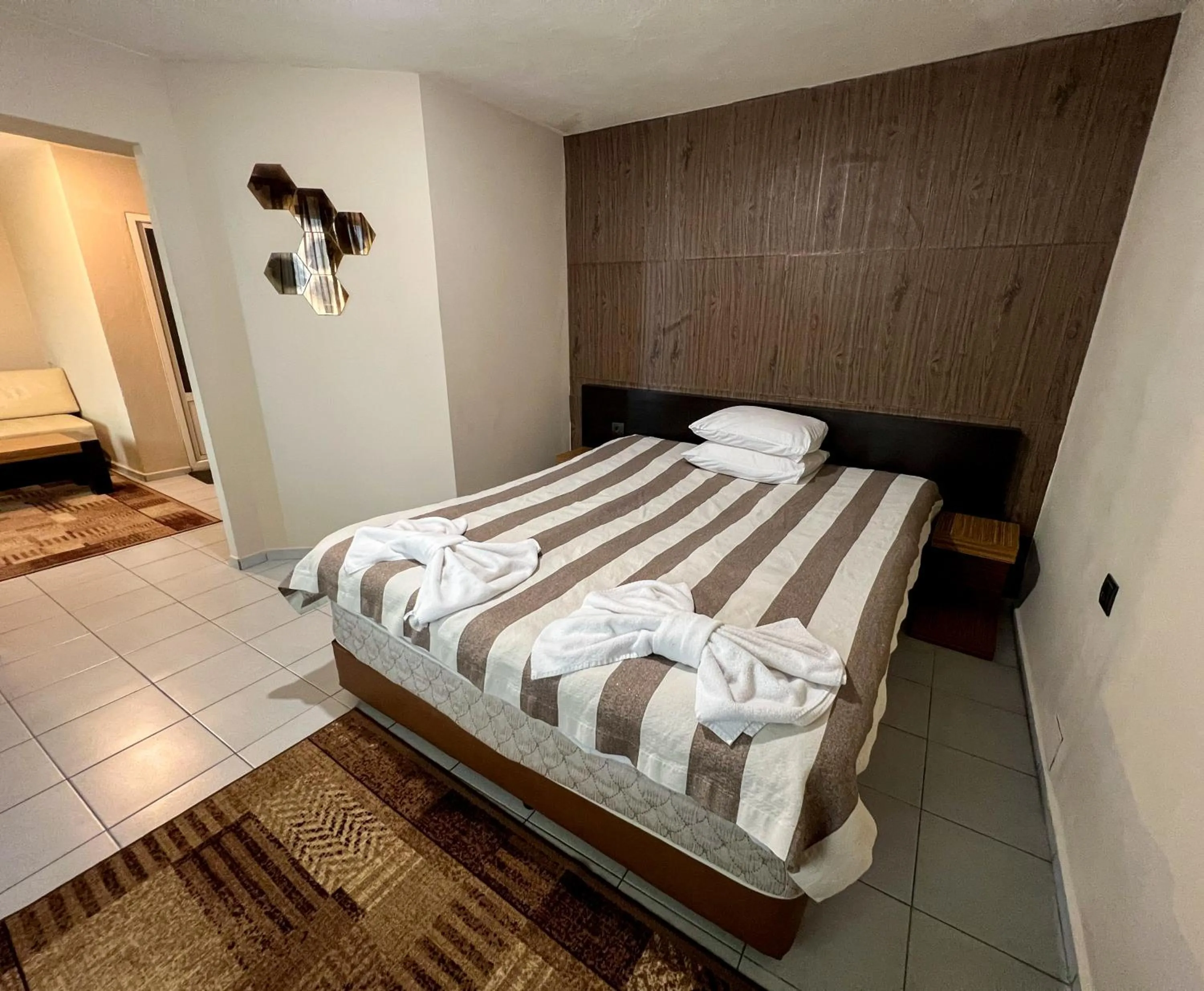 Bed in ALPHA family HOTEL