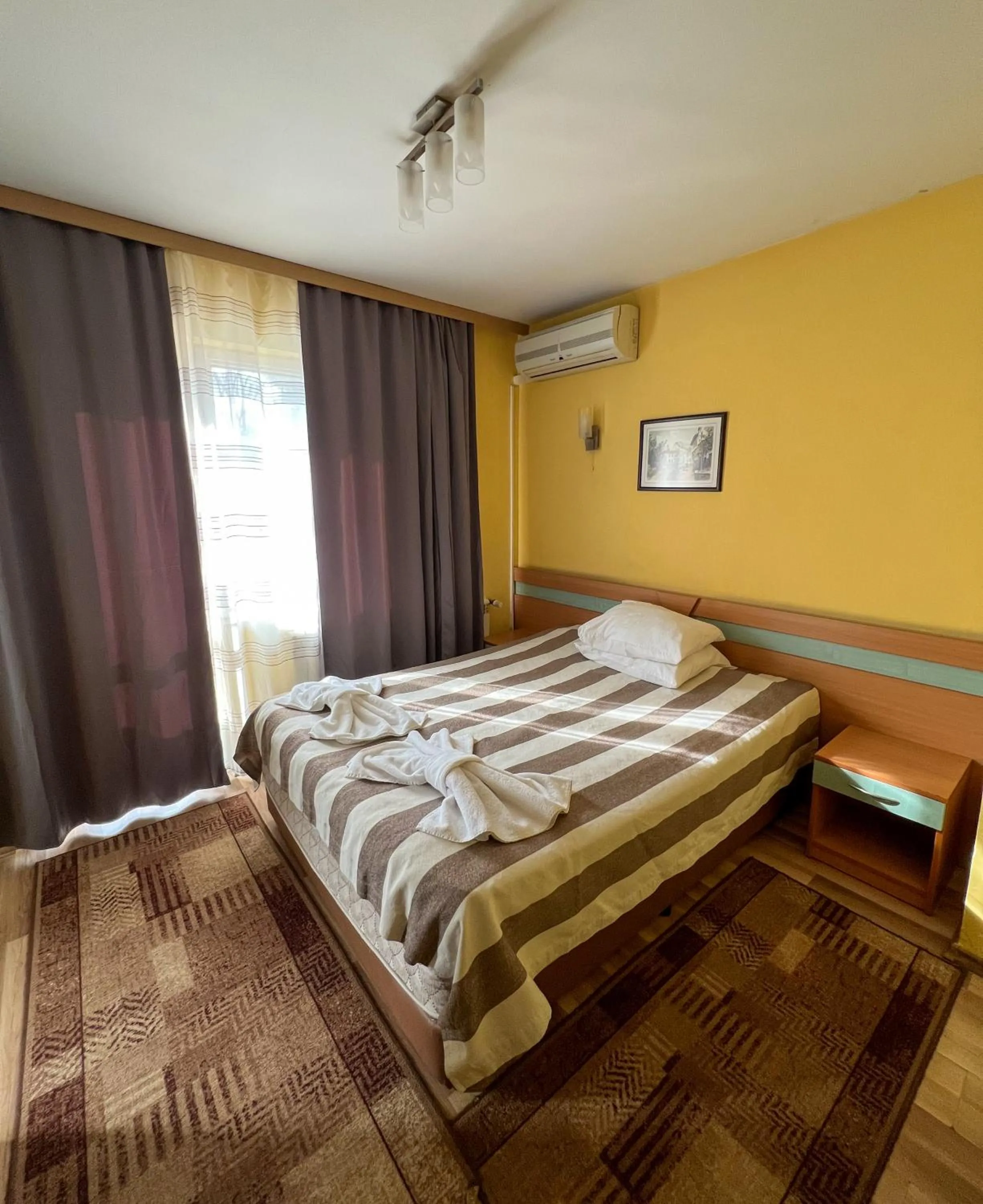 Bed in ALPHA family HOTEL