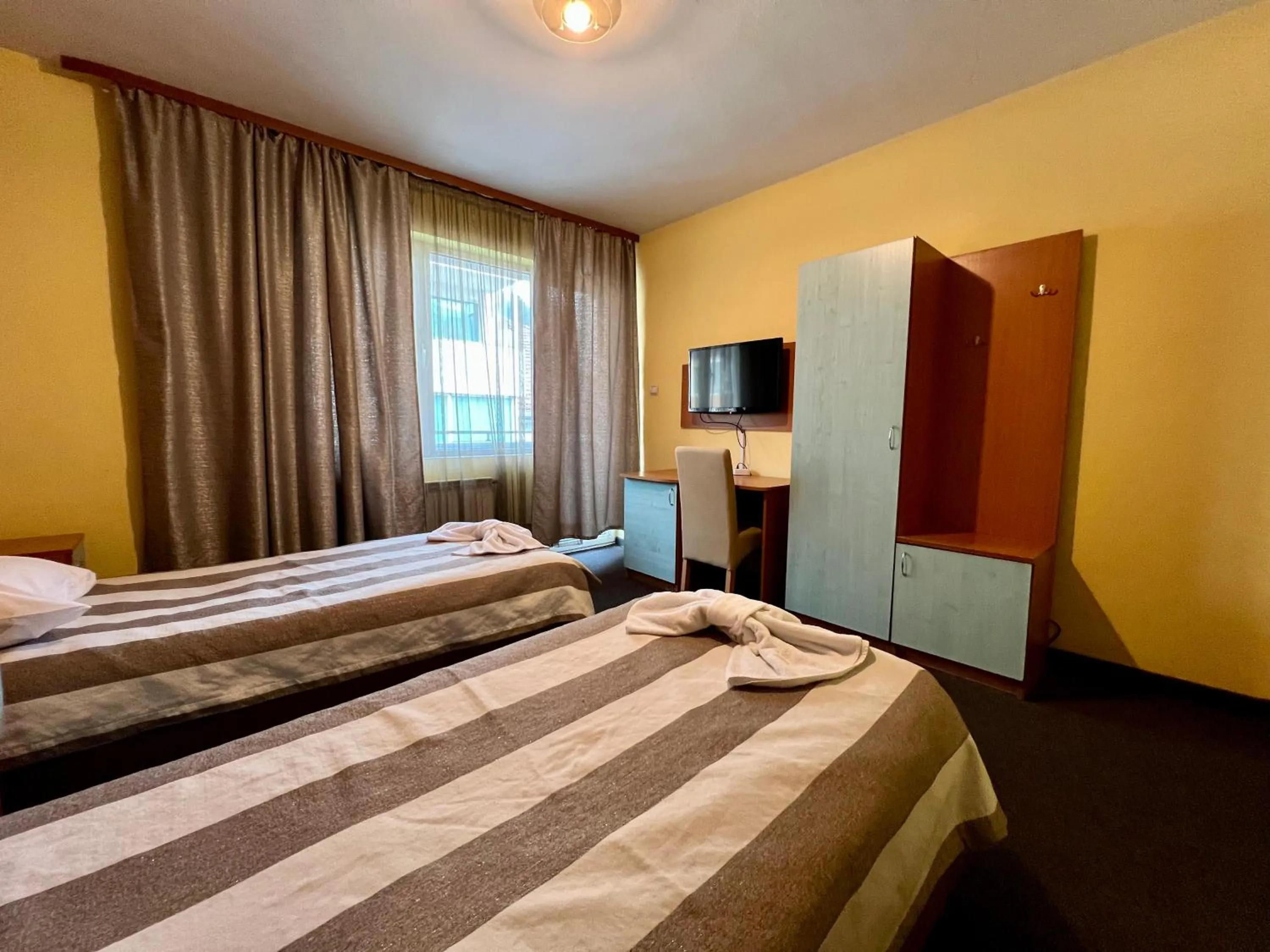 Bed in ALPHA family HOTEL