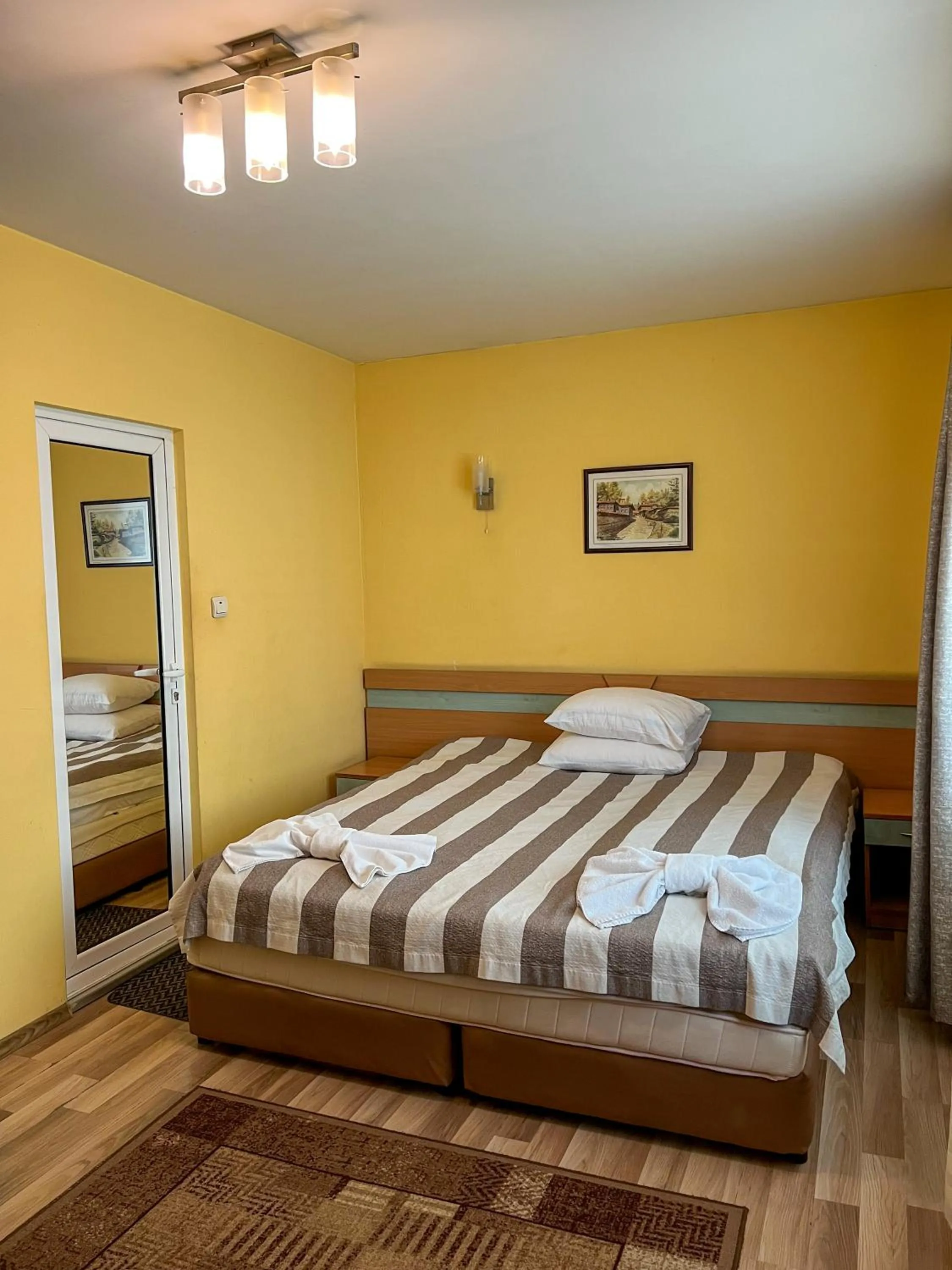 Bed in ALPHA family HOTEL