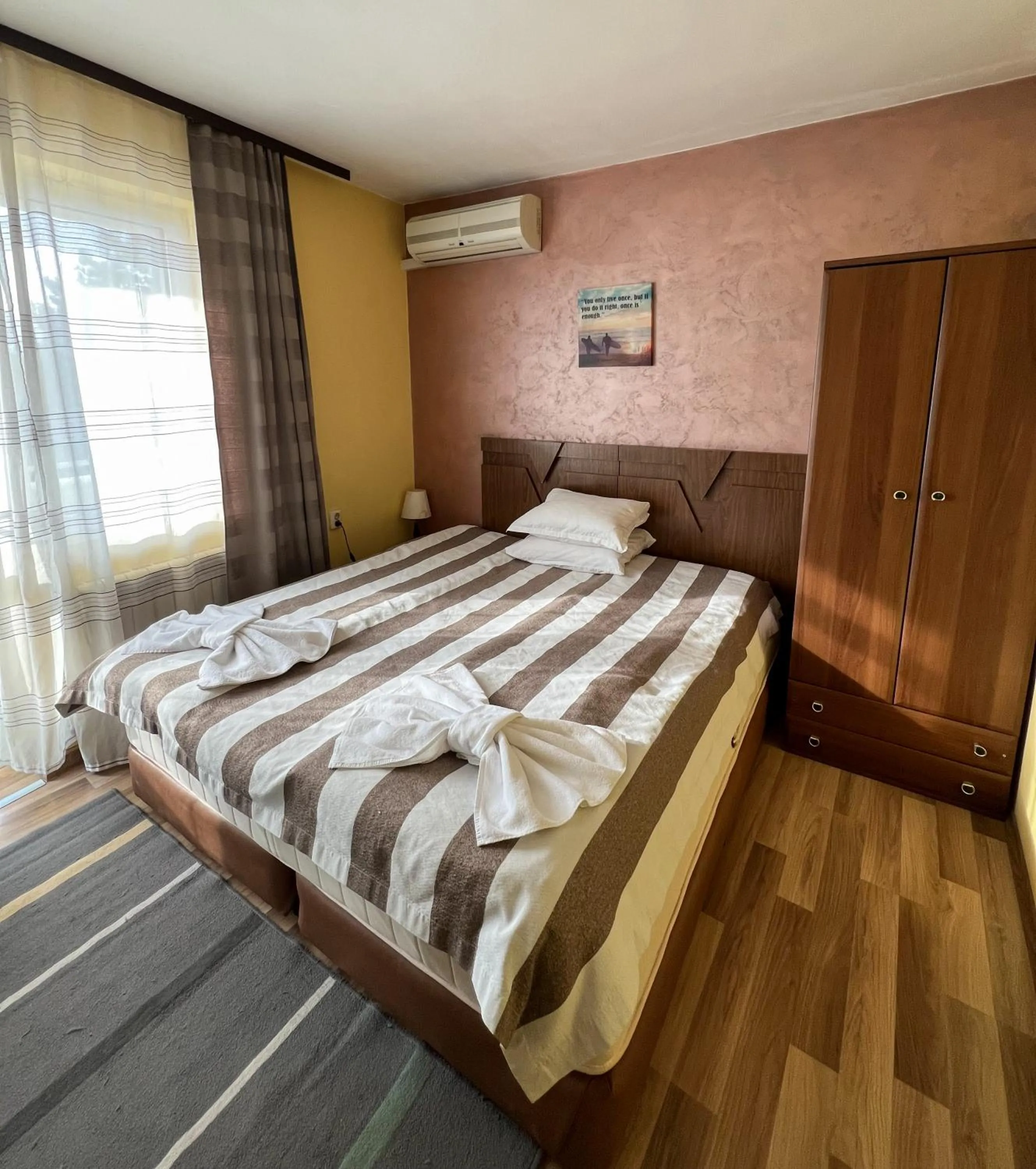 Bed in ALPHA family HOTEL