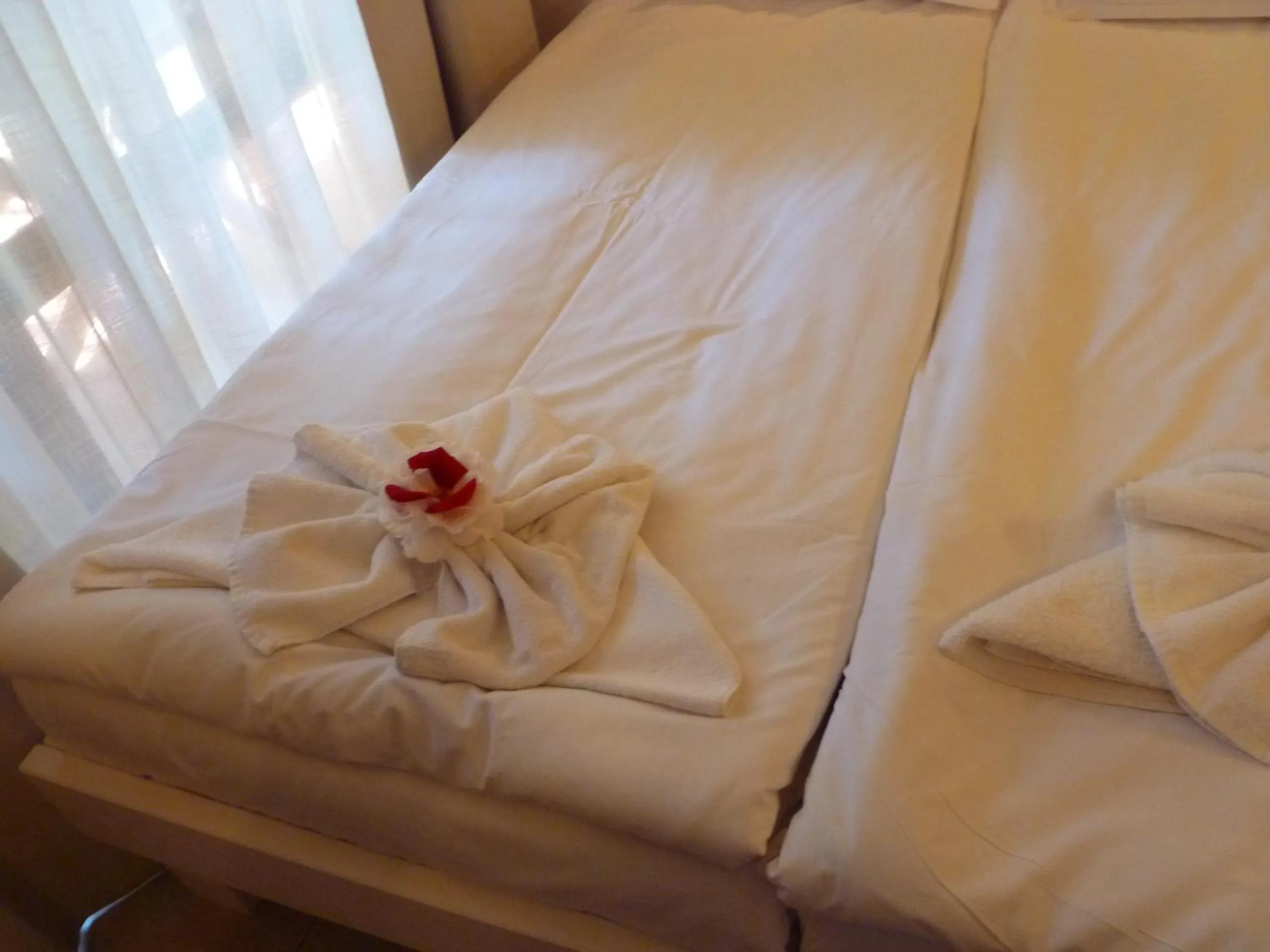 towels, Bed in Apartment Tourist Complex Rose Village