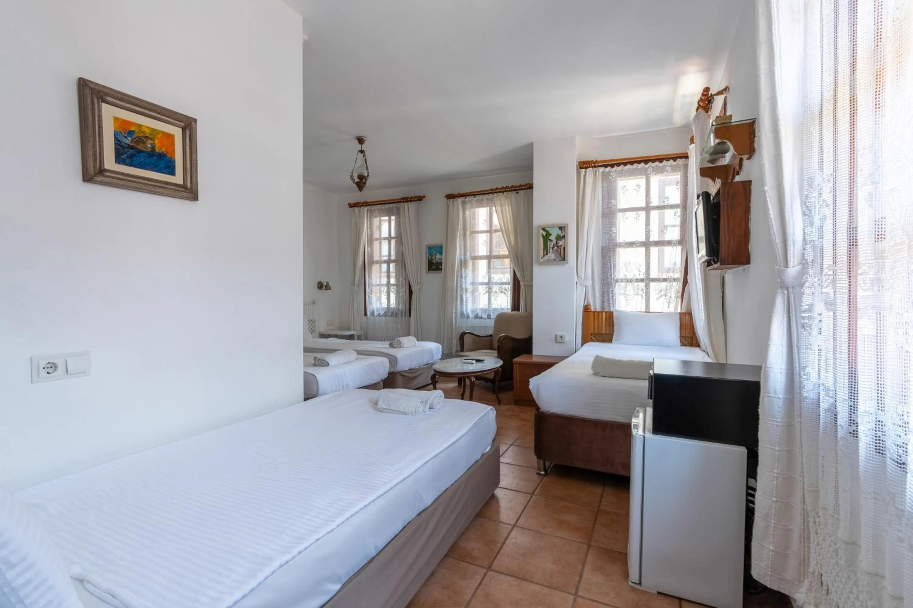 Bed in Atelya Art Hotel