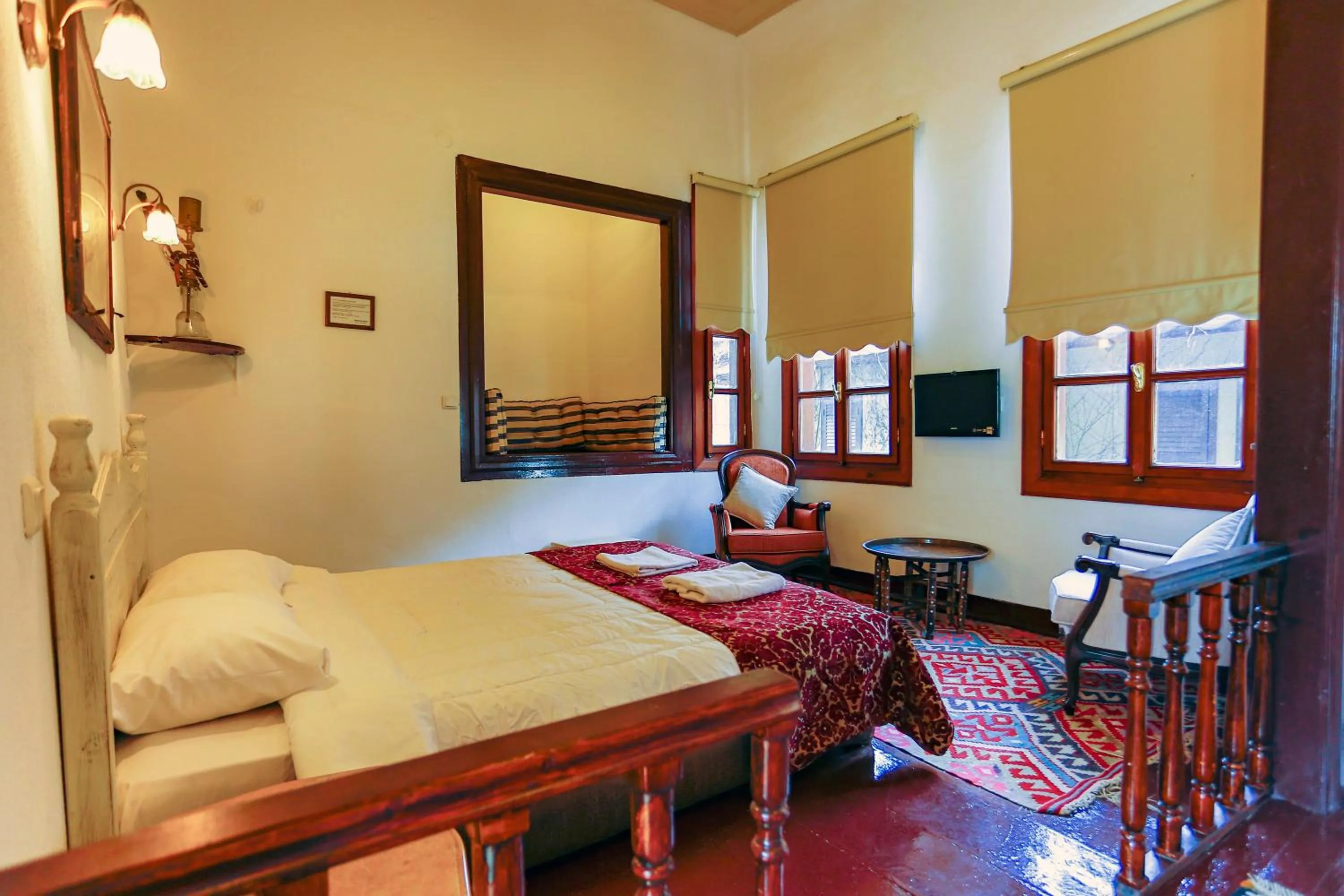 Bed in Atelya Art Hotel