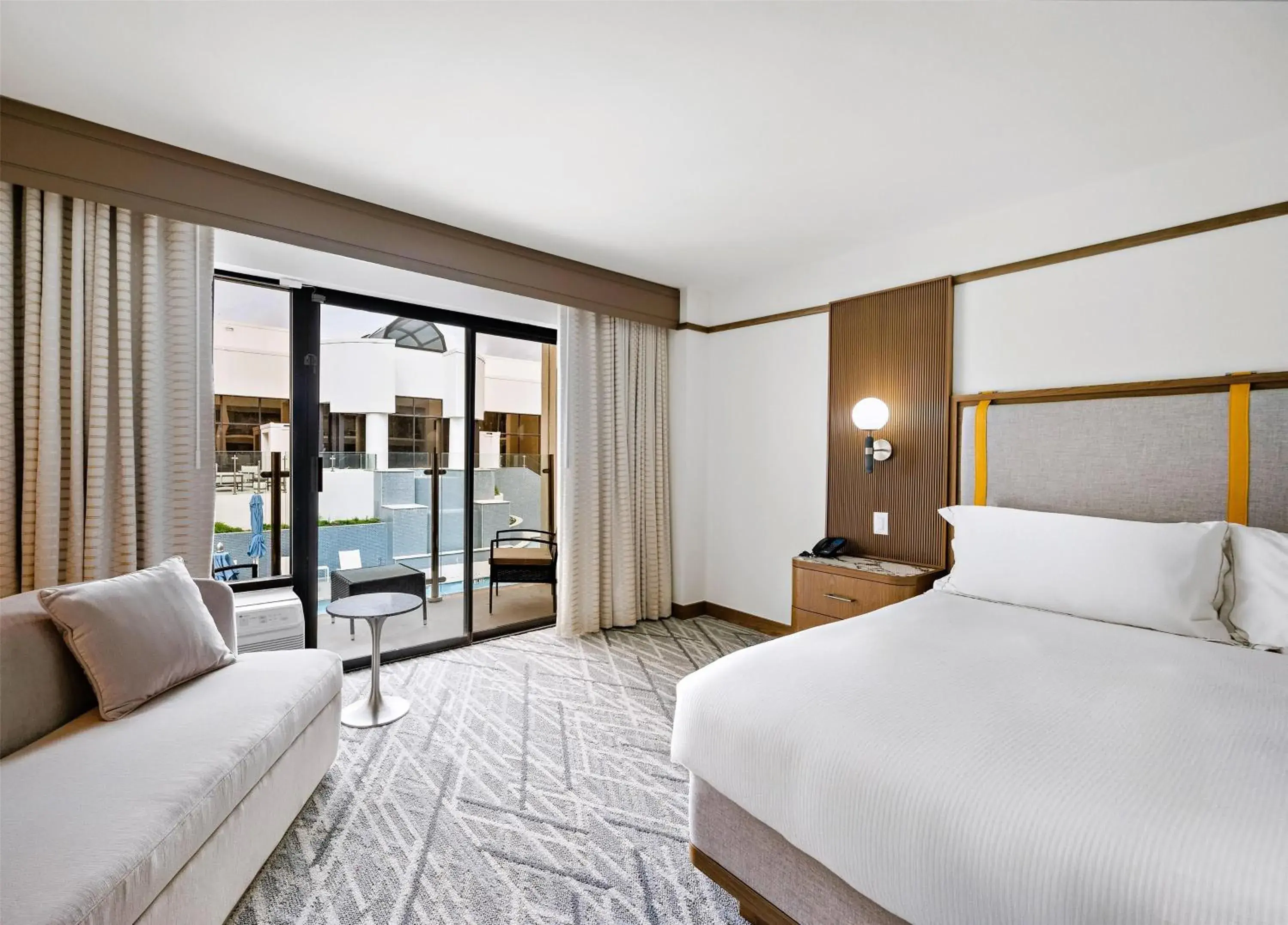 Queen Room with Two Queen Beds and Poolside View in Hilton College Station & Conference Center Queen Room with Two Queen Beds and Poolside View in Hilton College Station & Conference Center