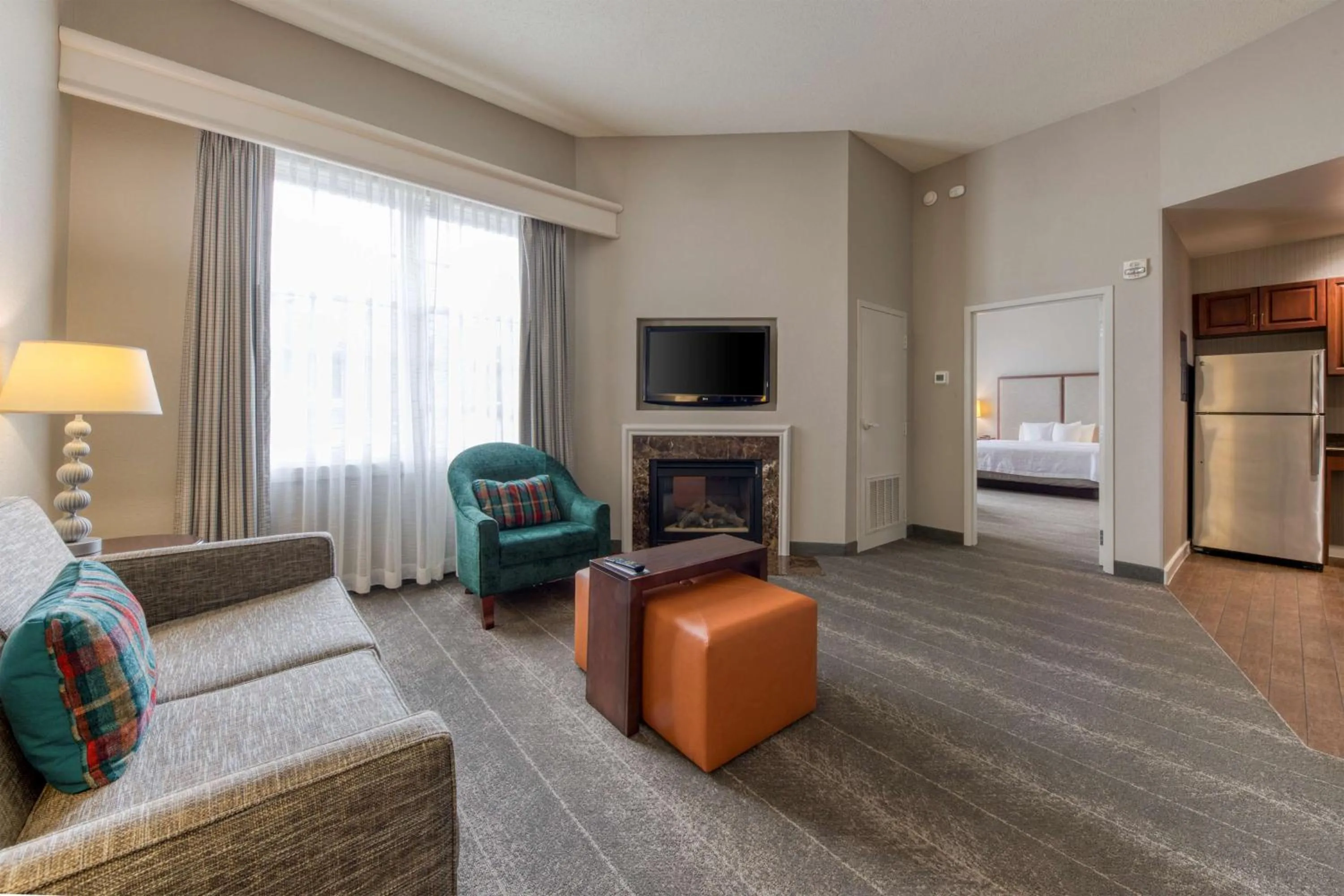 Living room, Bed in Homewood Suites by Hilton Olmsted Village