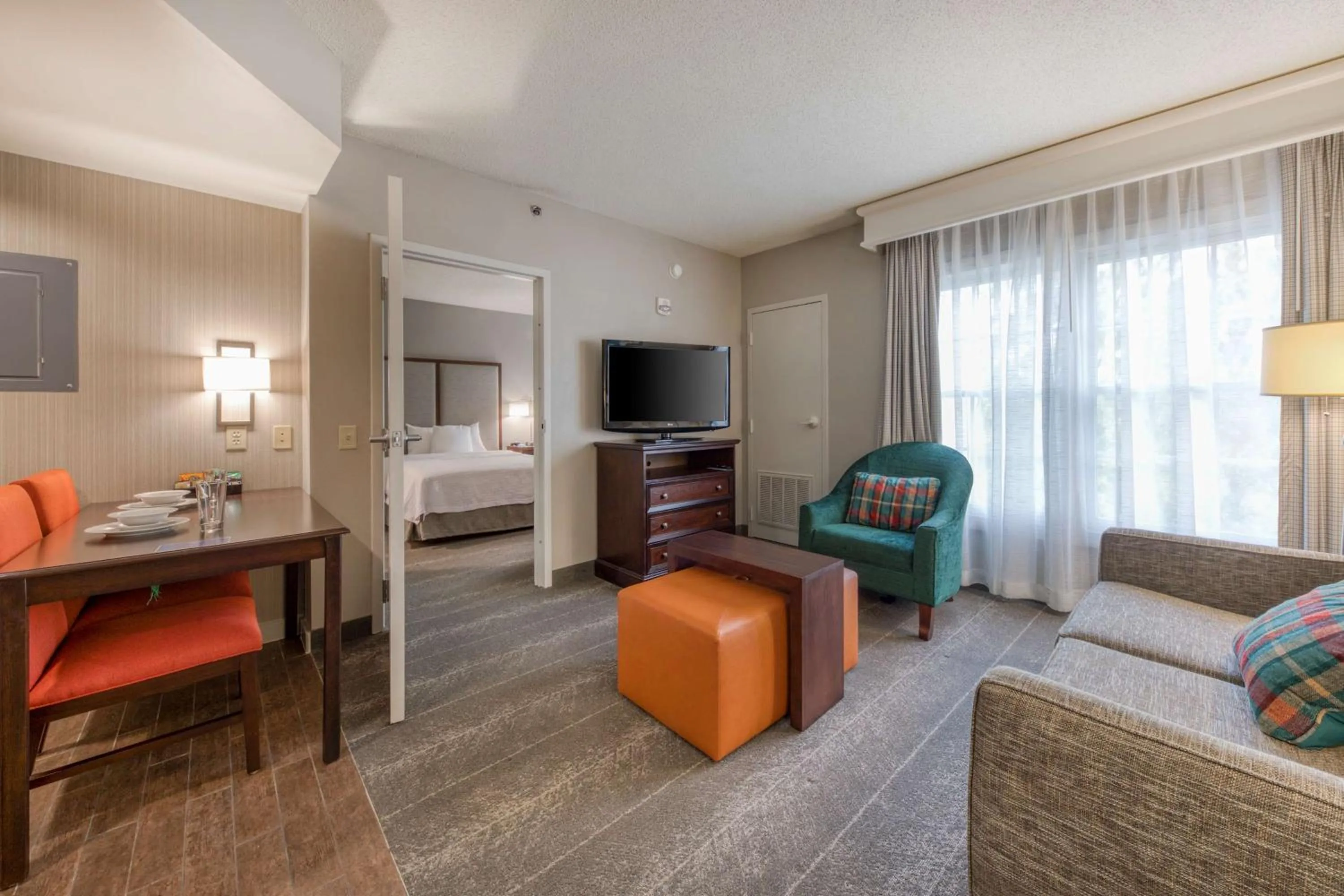 Living room, Bed in Homewood Suites by Hilton Olmsted Village
