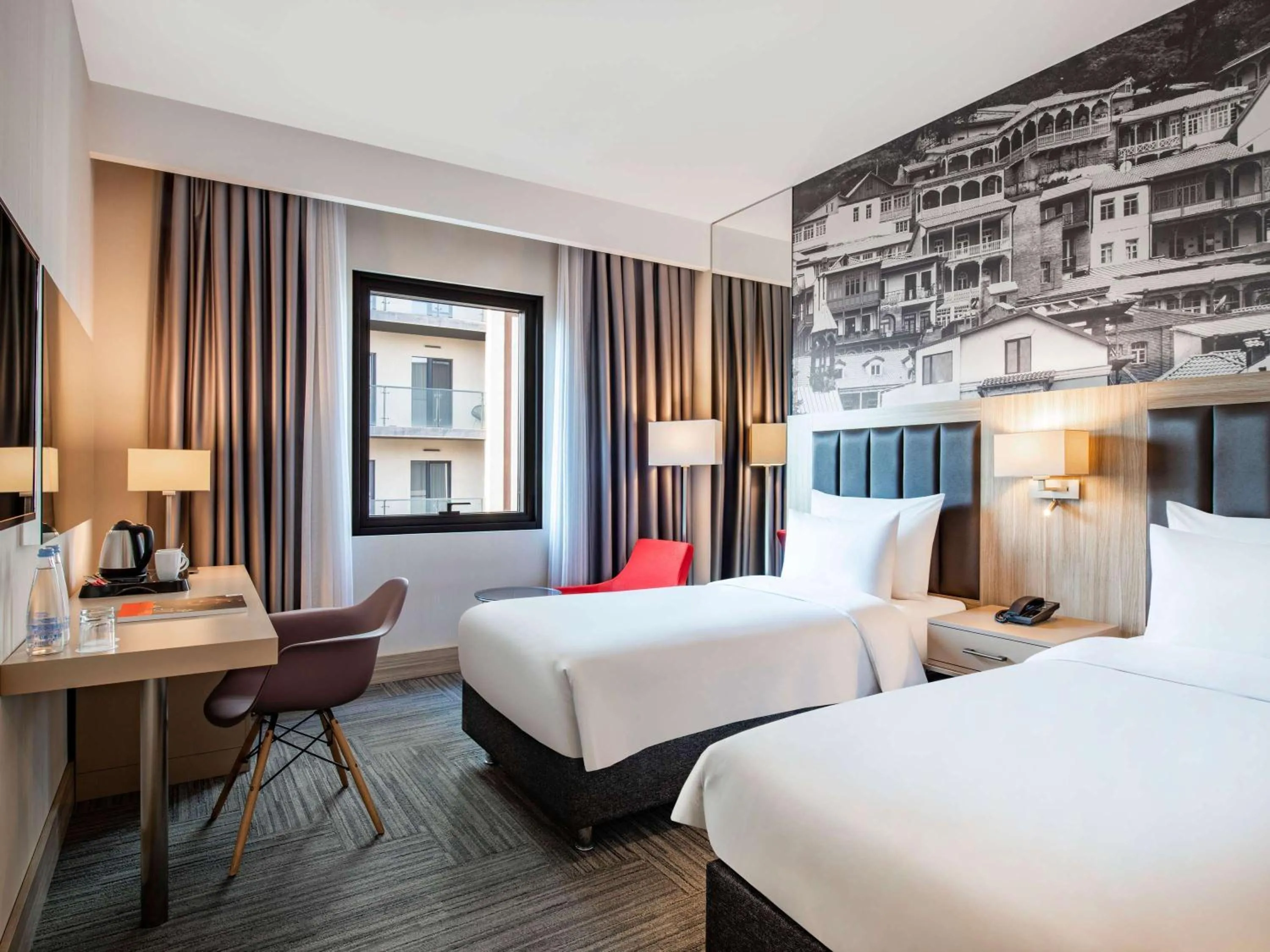 Bed in Ramada Encore Tbilisi