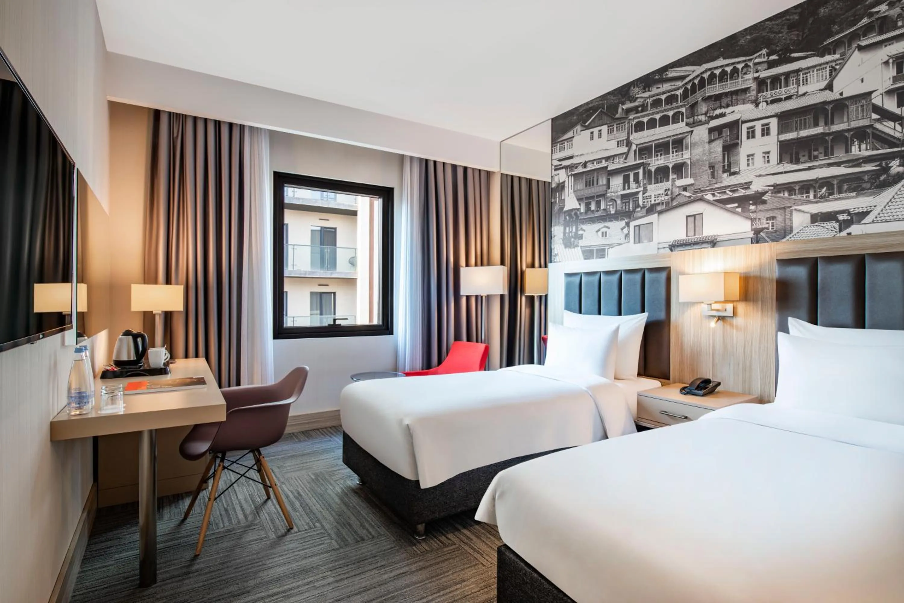 Bed in Ramada Encore Tbilisi