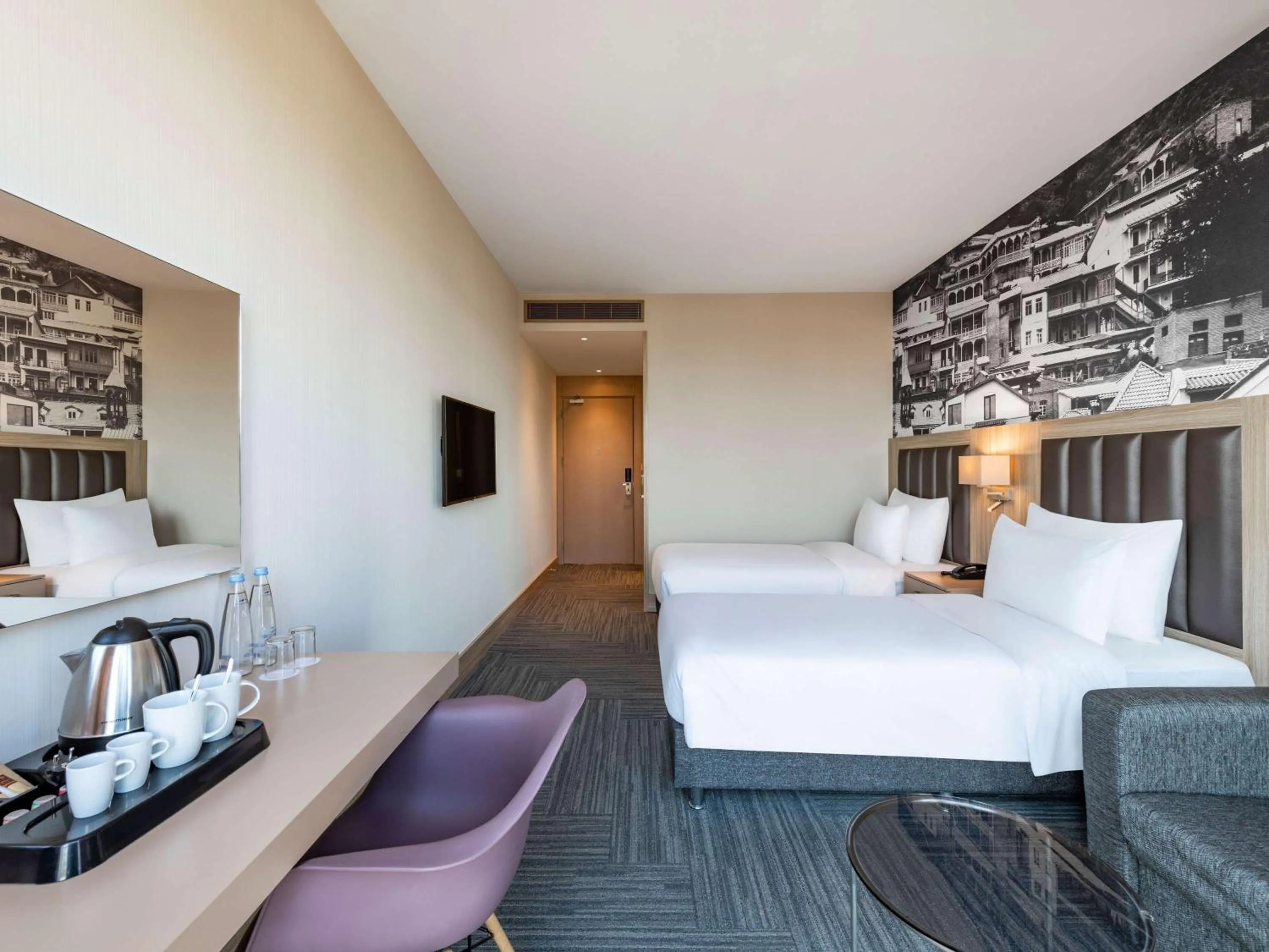 Bed in Ramada Encore Tbilisi