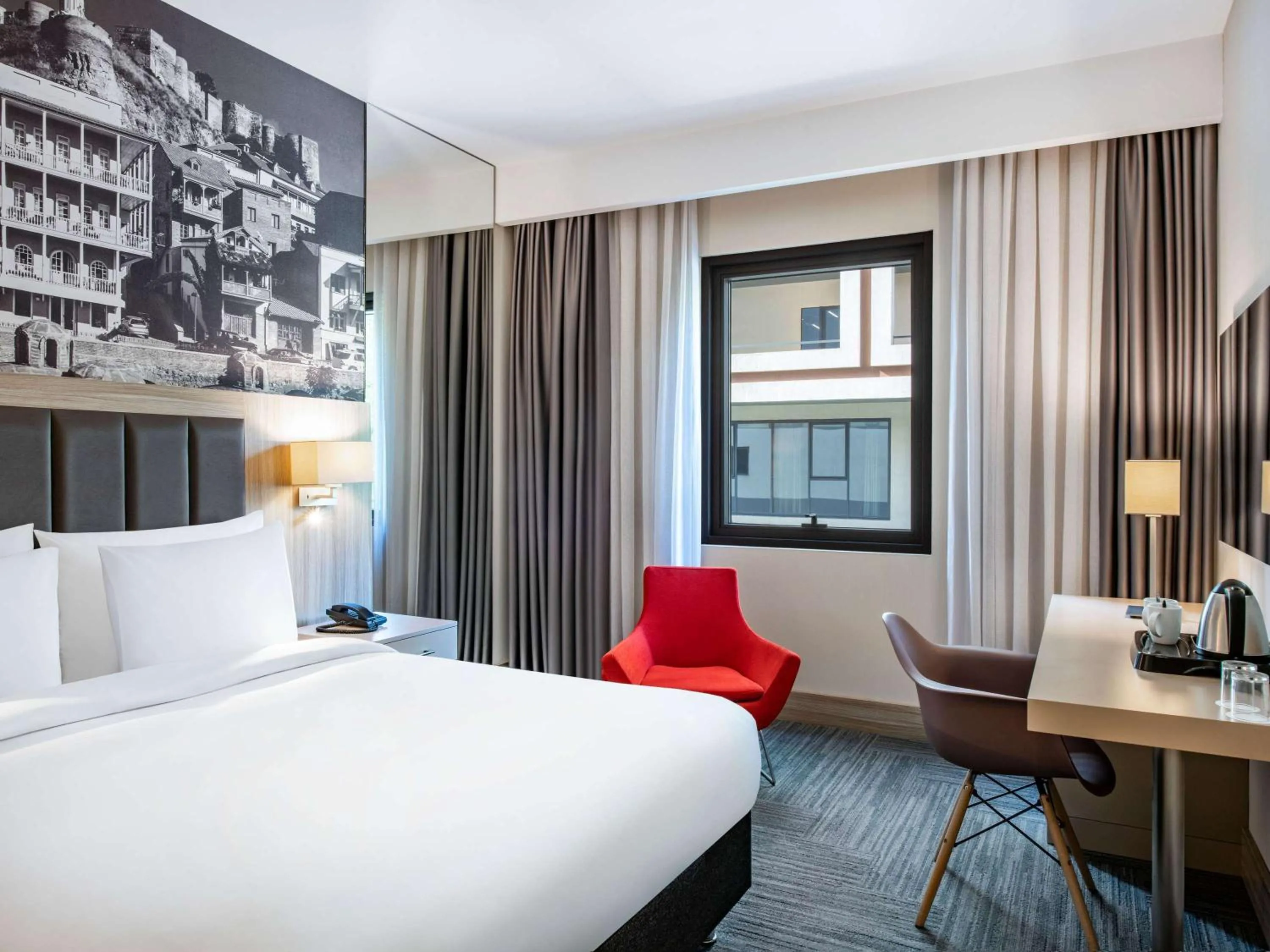 Bed in Ramada Encore Tbilisi