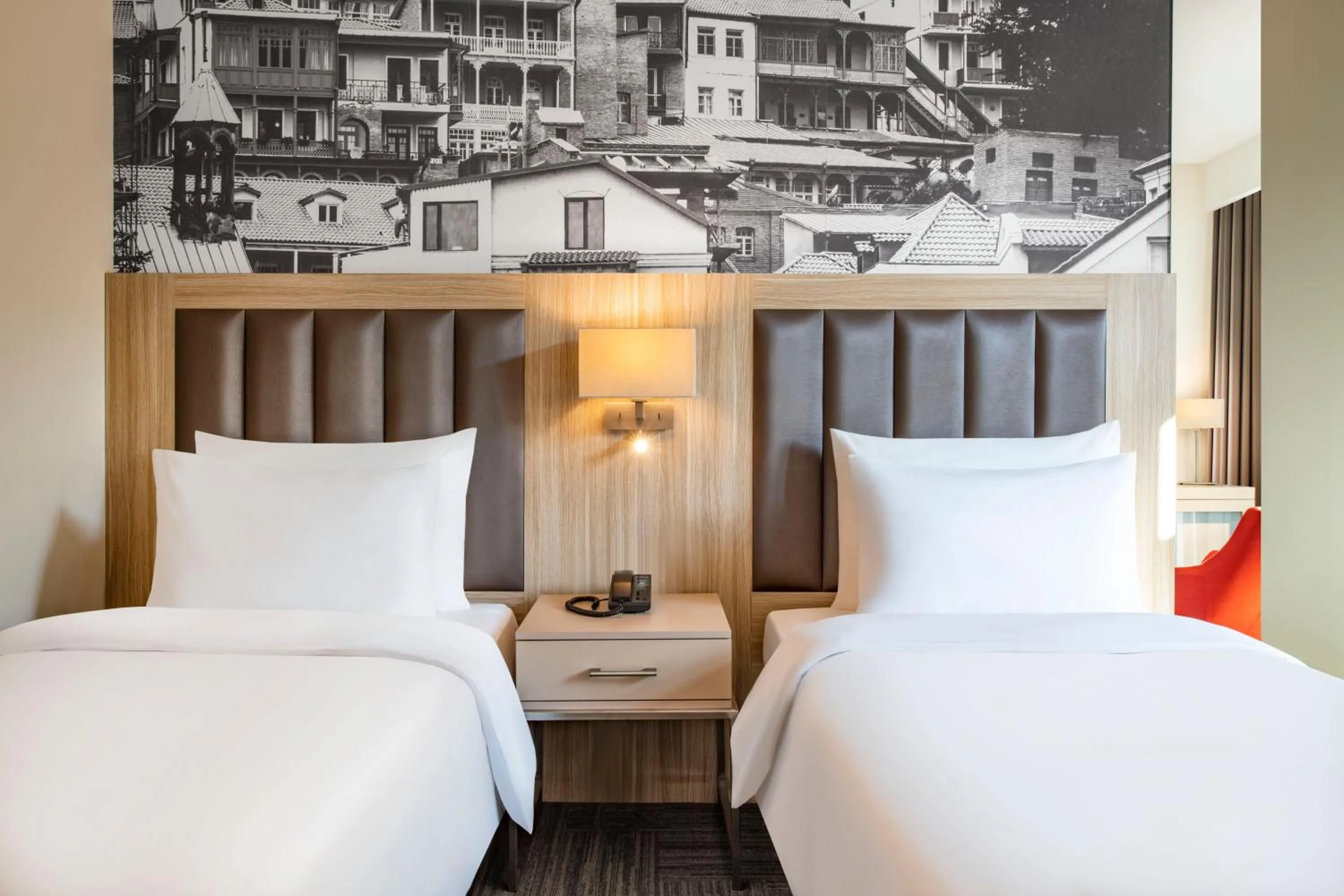 Bed in Ramada Encore Tbilisi