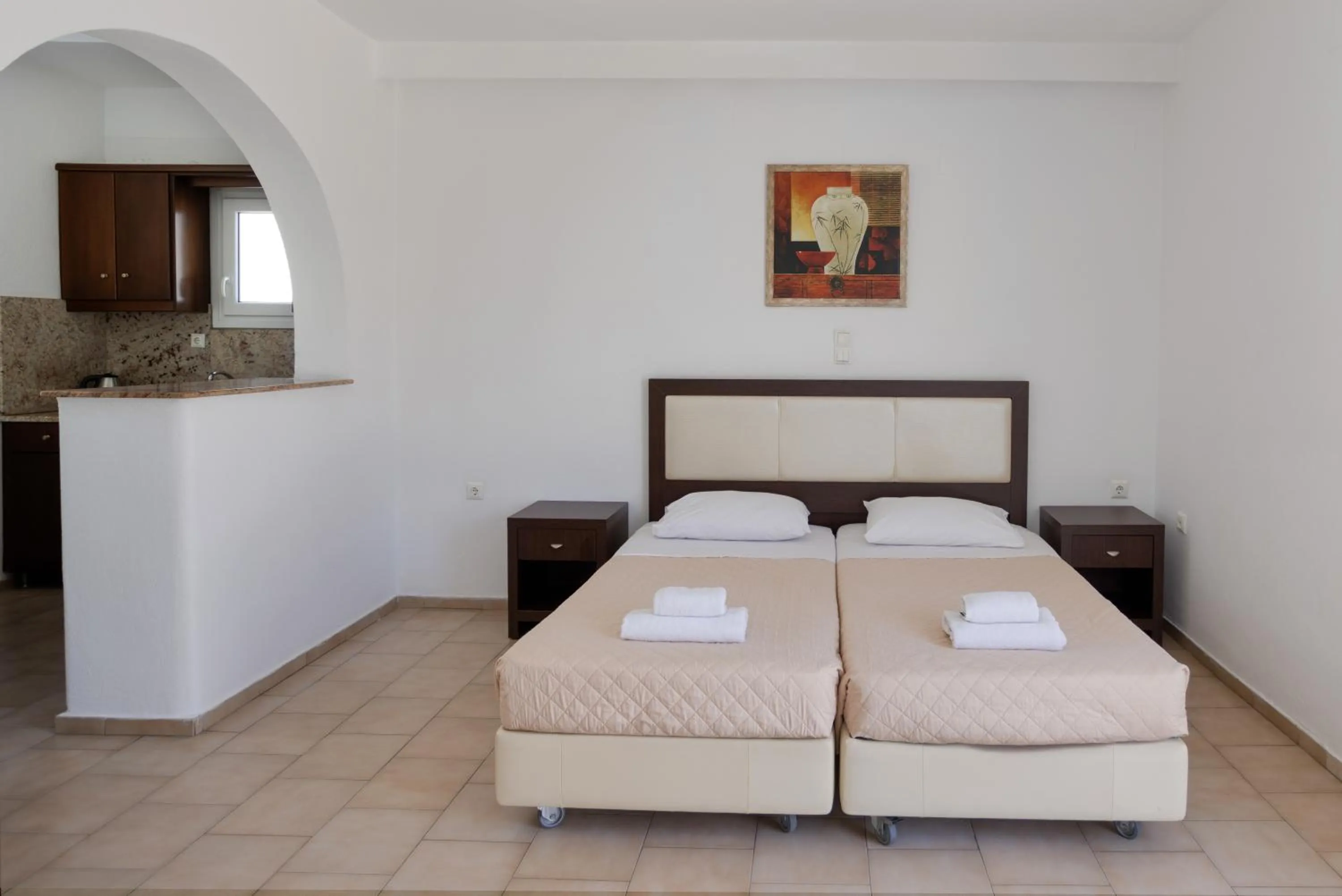 Bed in Elena Studios & Suites