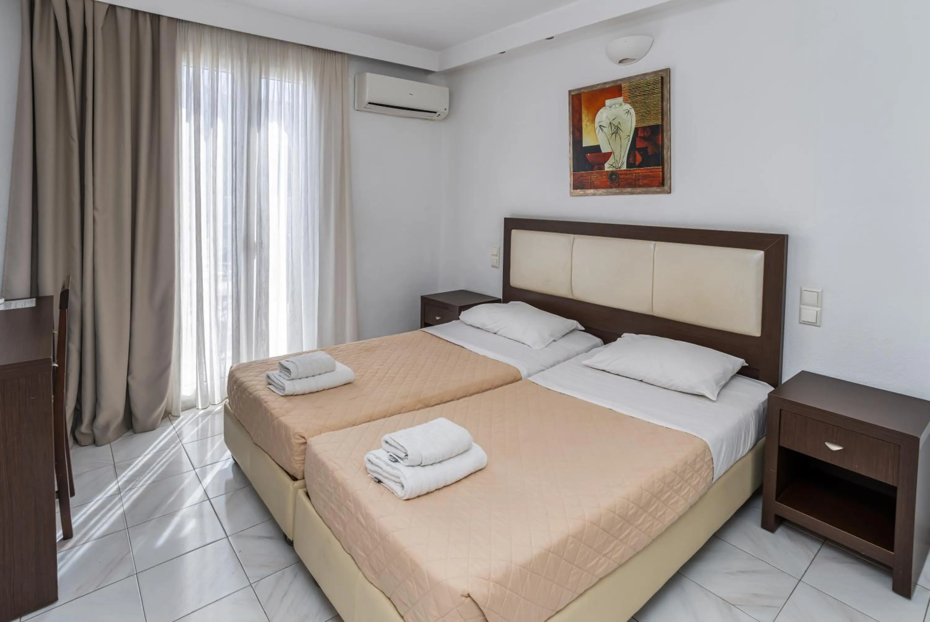 Bed in Elena Studios & Suites