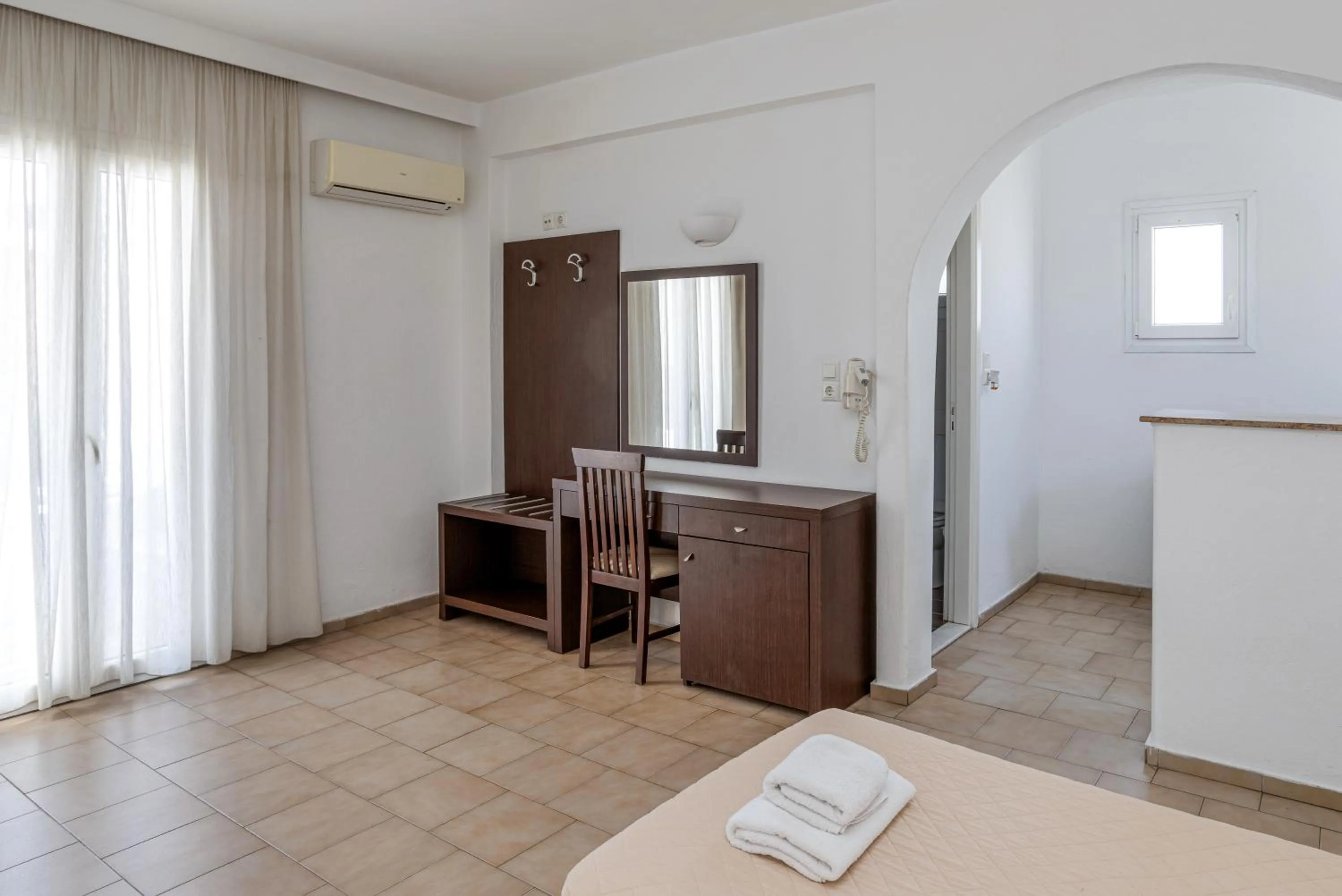 Bed in Elena Studios & Suites