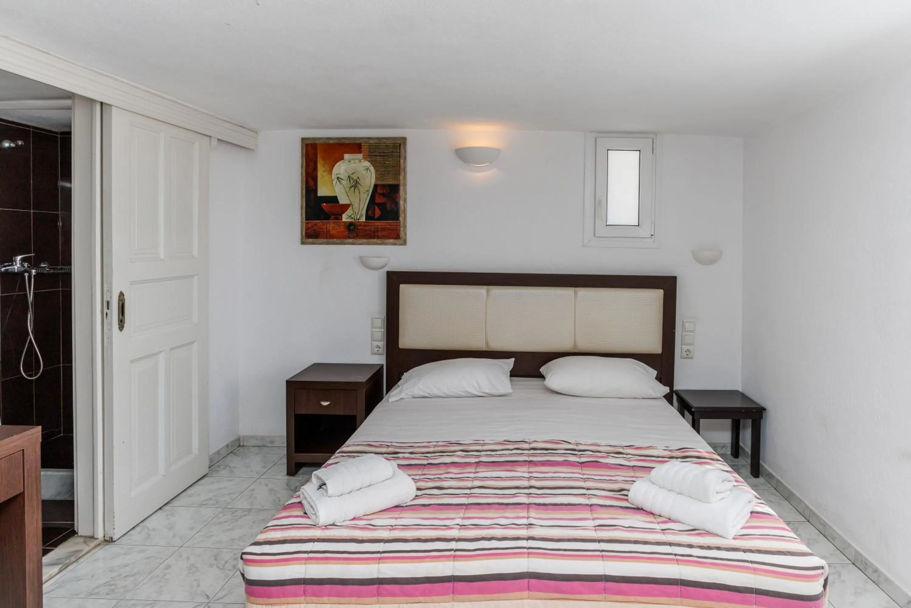 Bed in Elena Studios & Suites