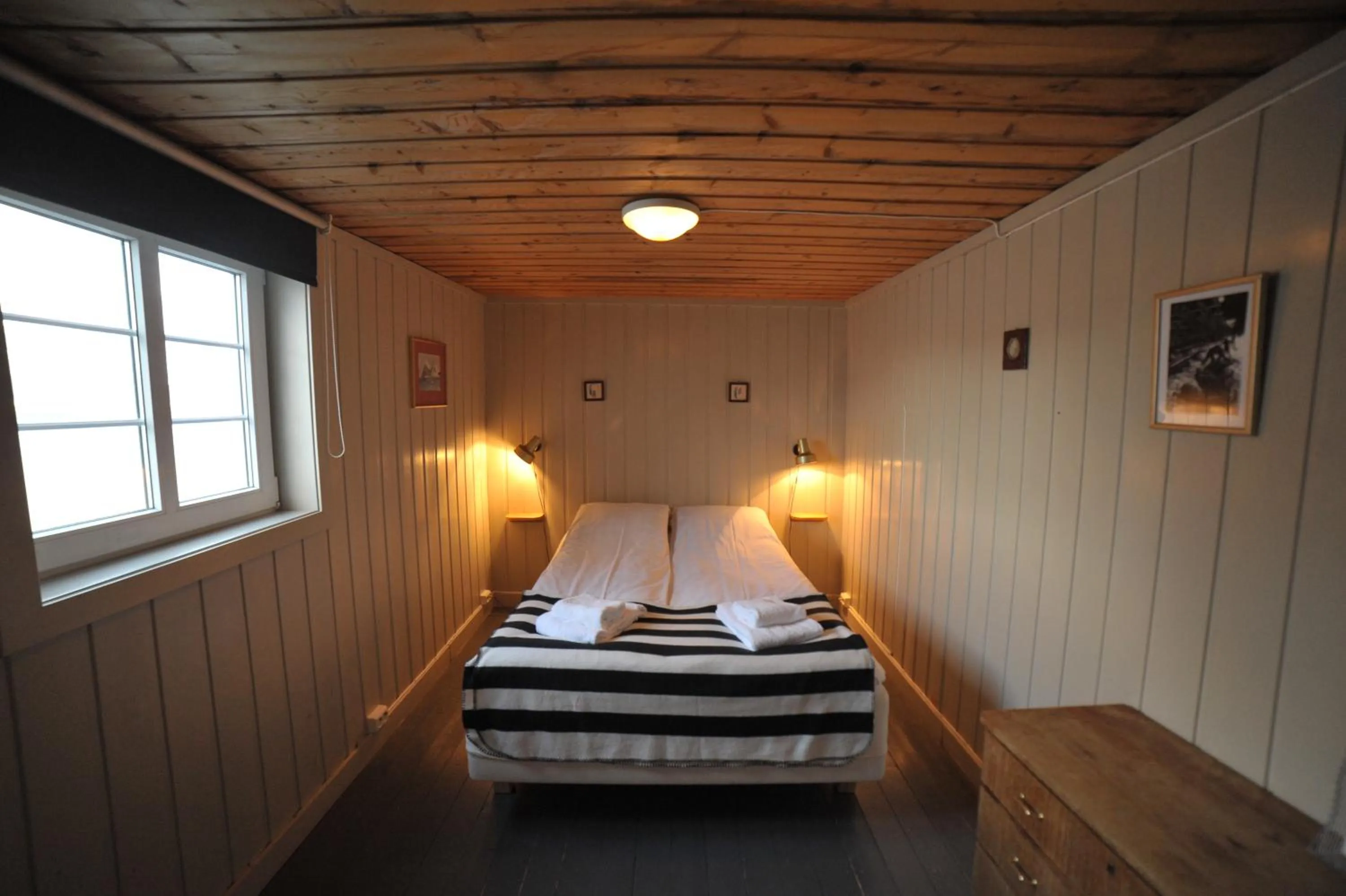 Bedroom, Bed in Reine Rorbuer - by Classic Norway Hotels