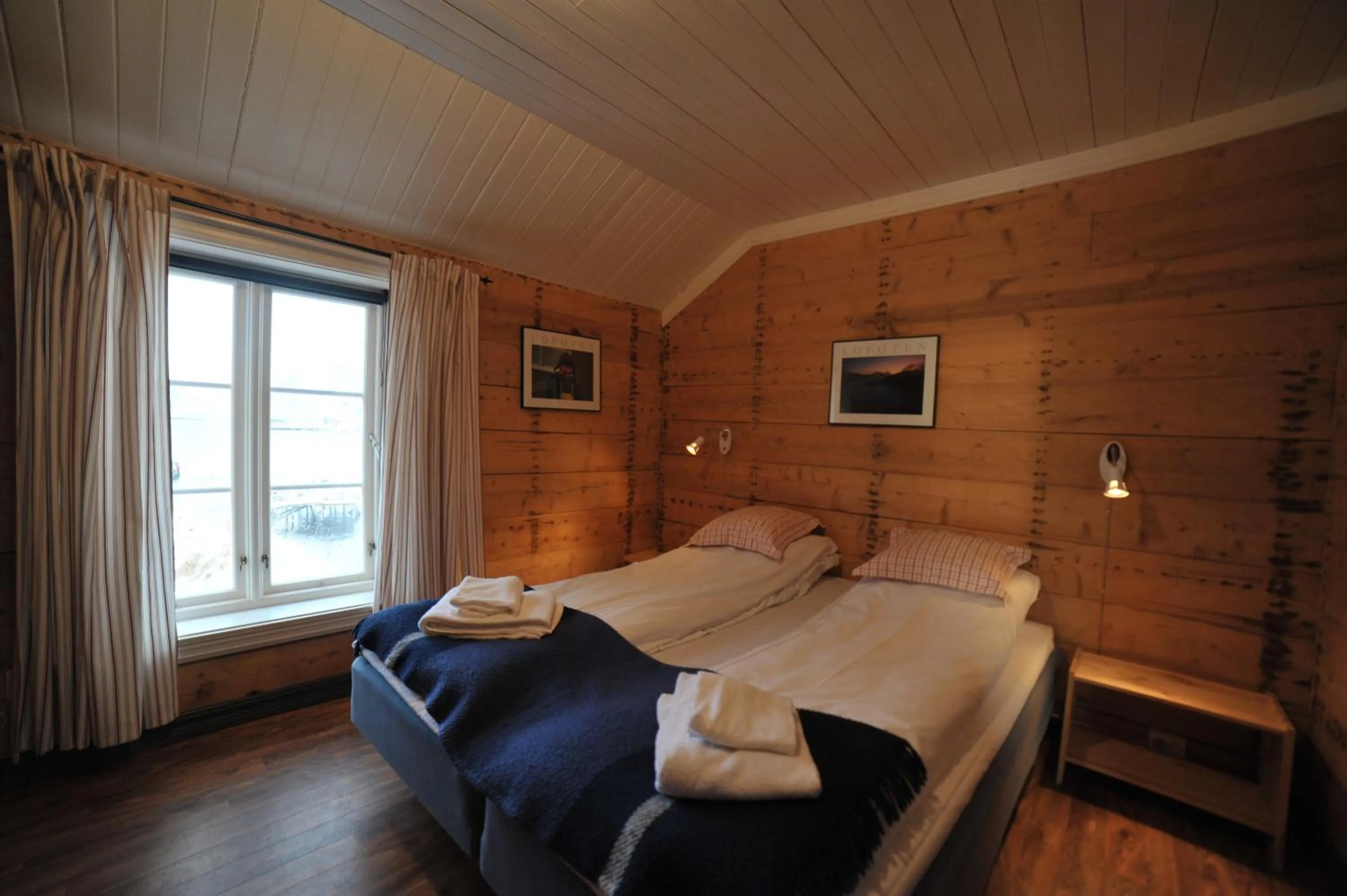 Bedroom, Bed in Reine Rorbuer - by Classic Norway Hotels