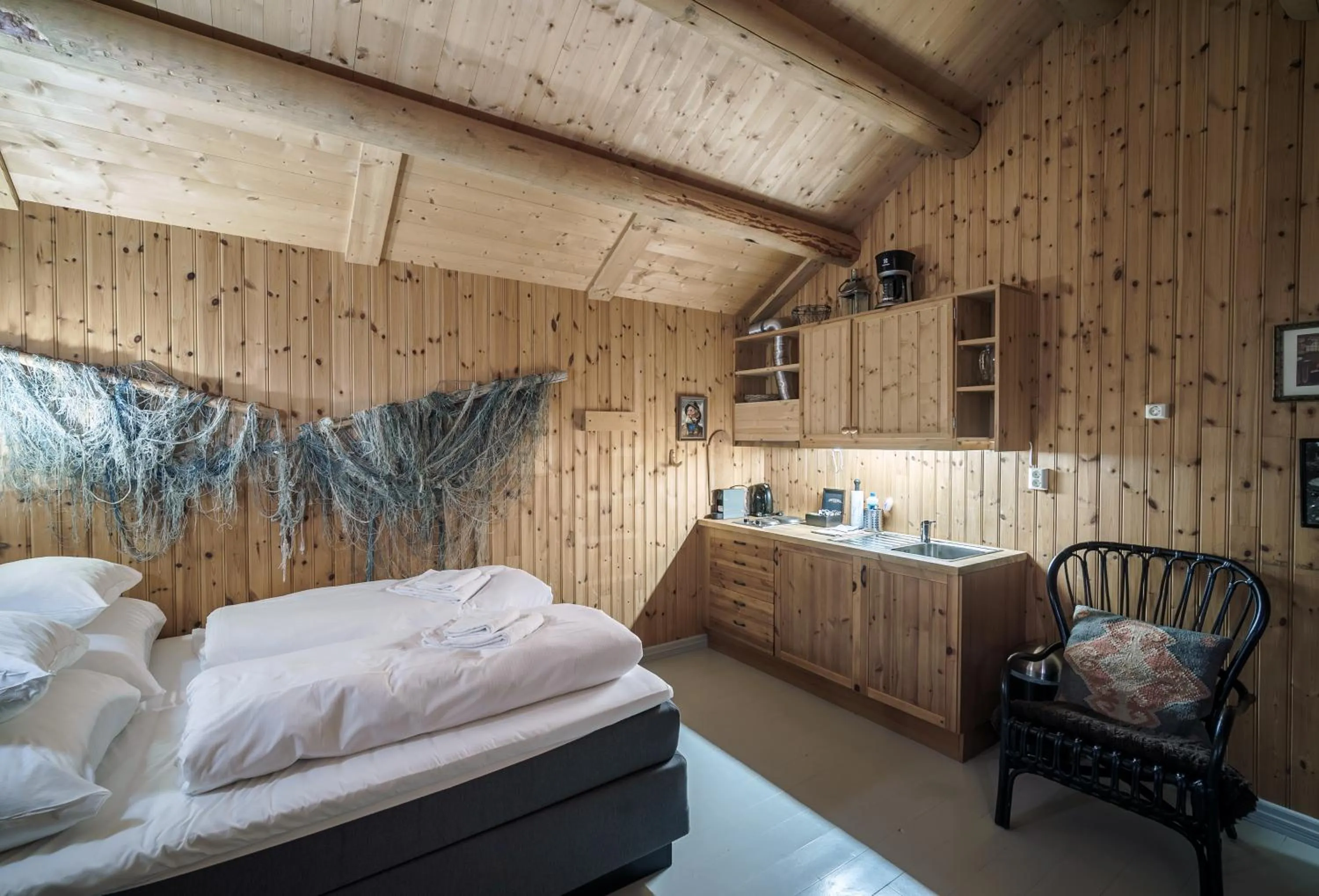 Bedroom, Bed in Reine Rorbuer - by Classic Norway Hotels