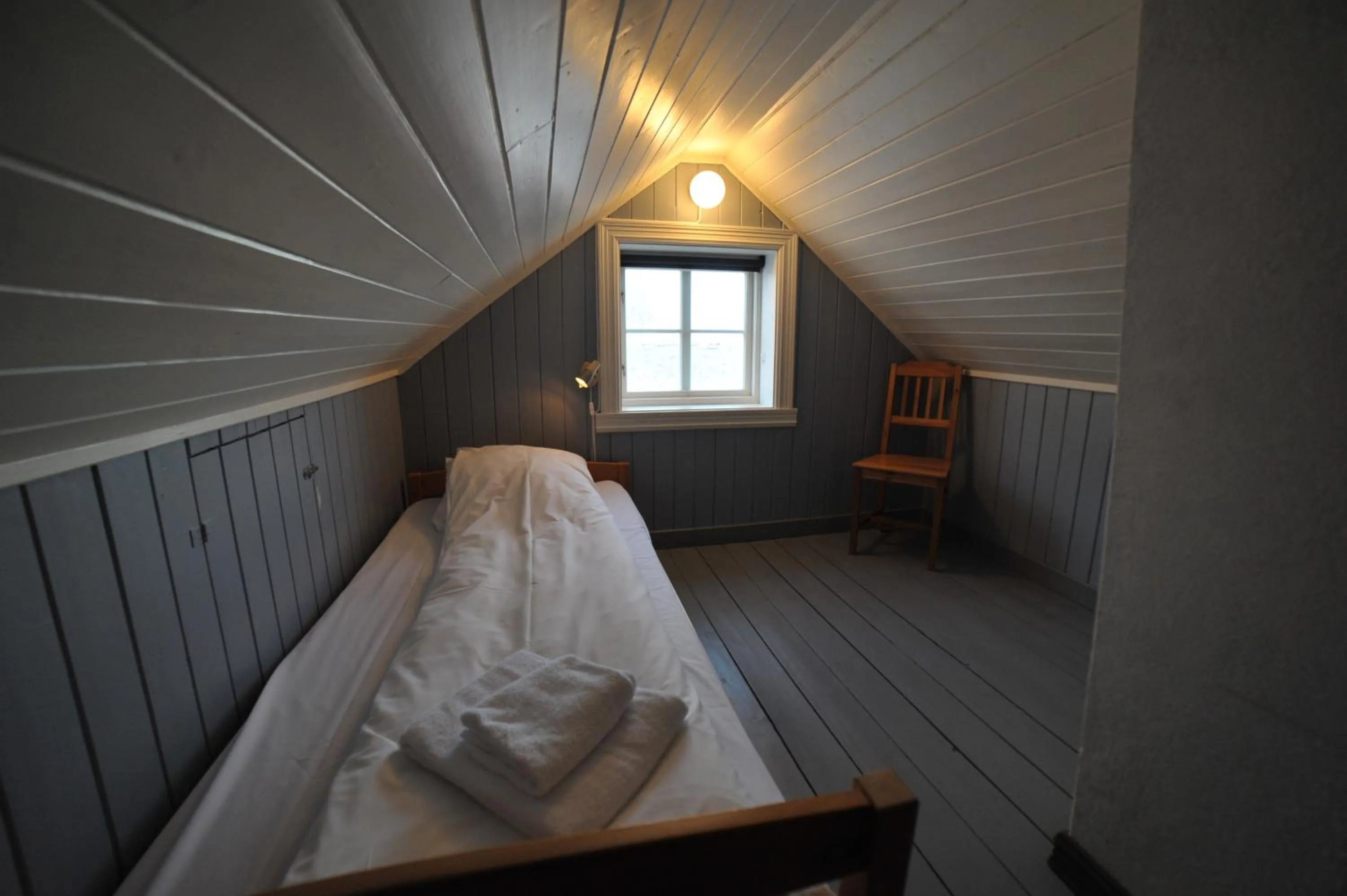 Bedroom, Bed in Reine Rorbuer - by Classic Norway Hotels
