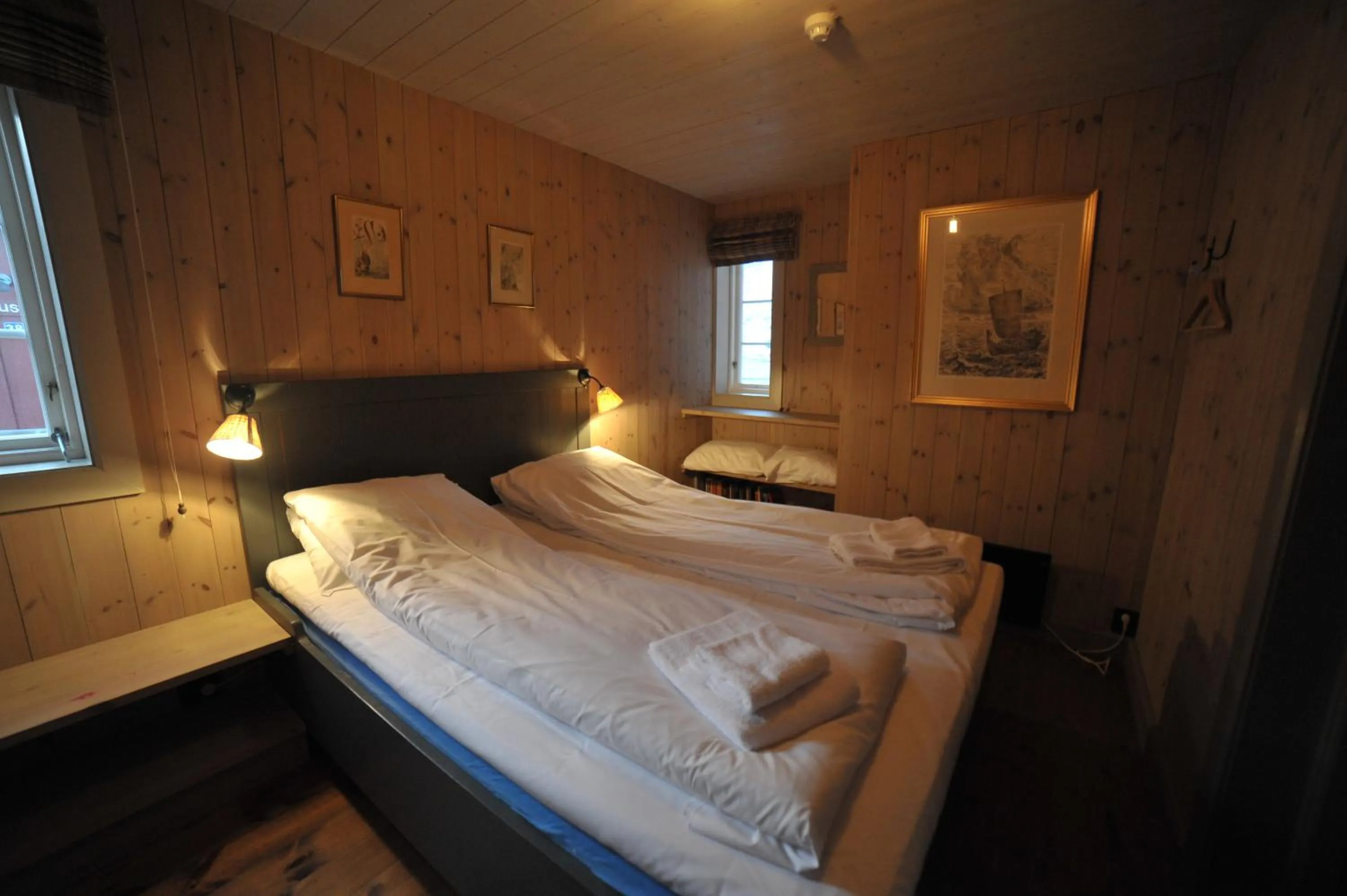 Bedroom, Bed in Reine Rorbuer - by Classic Norway Hotels