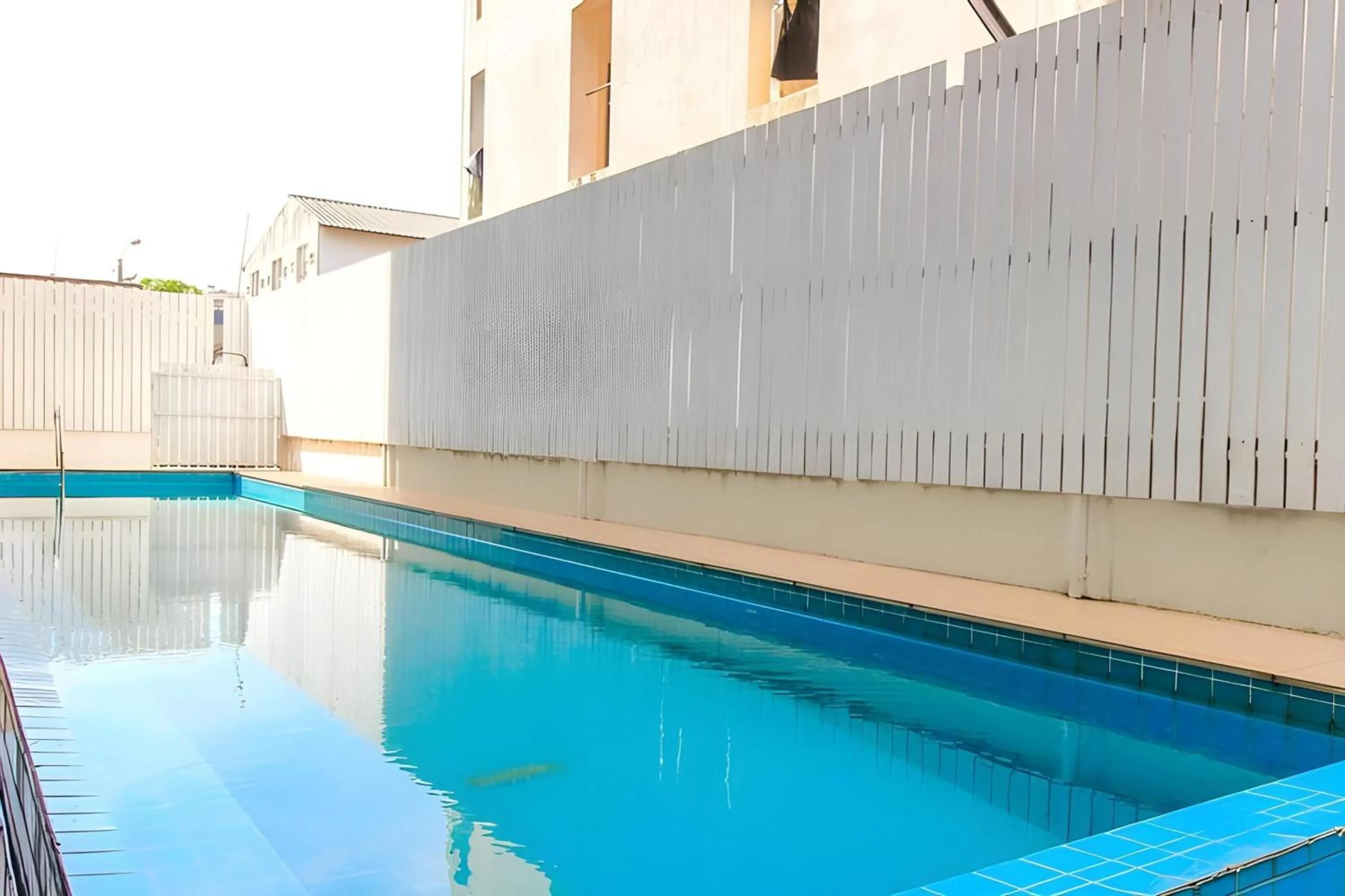 Swimming pool in Super OYO 427 Chill Apartment