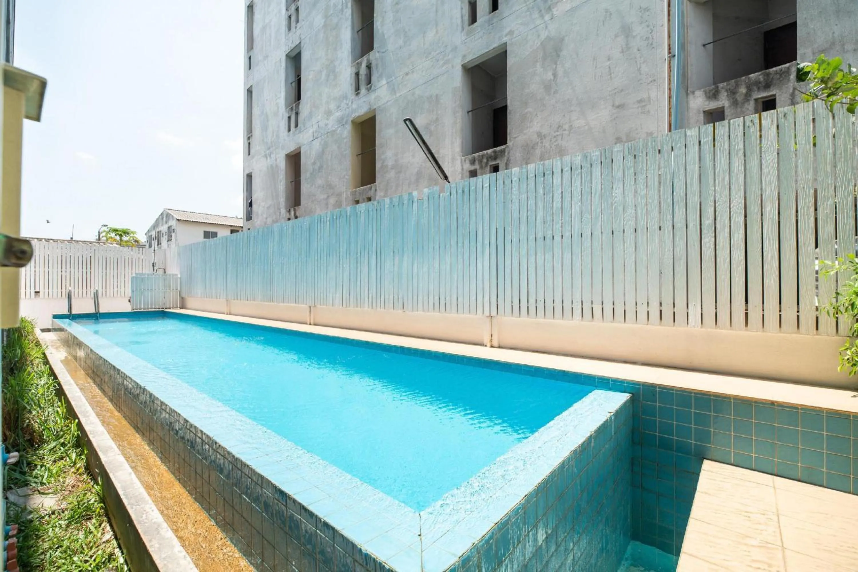 Swimming pool in Super OYO 427 Chill Apartment