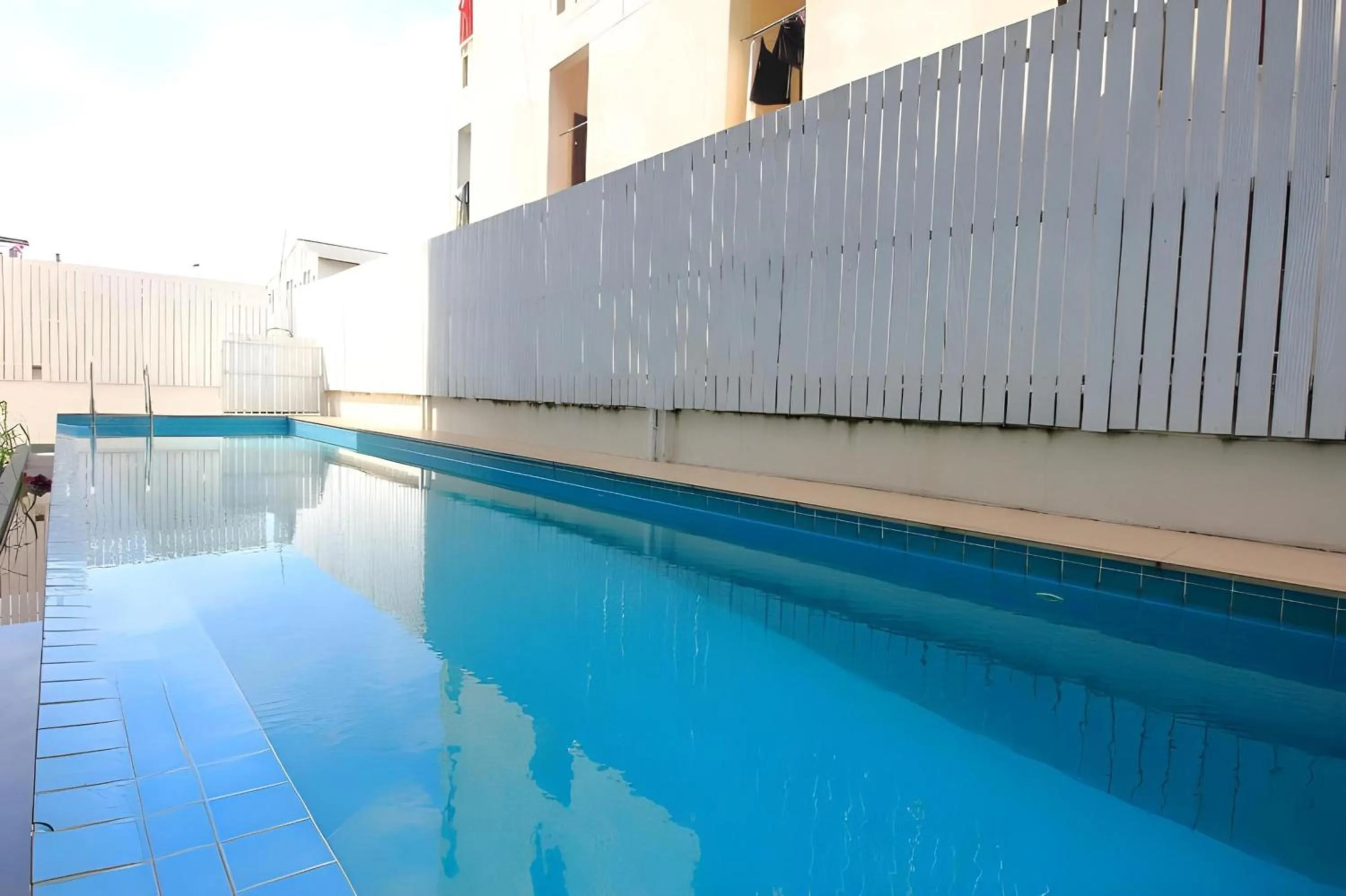 Swimming pool in Super OYO 427 Chill Apartment