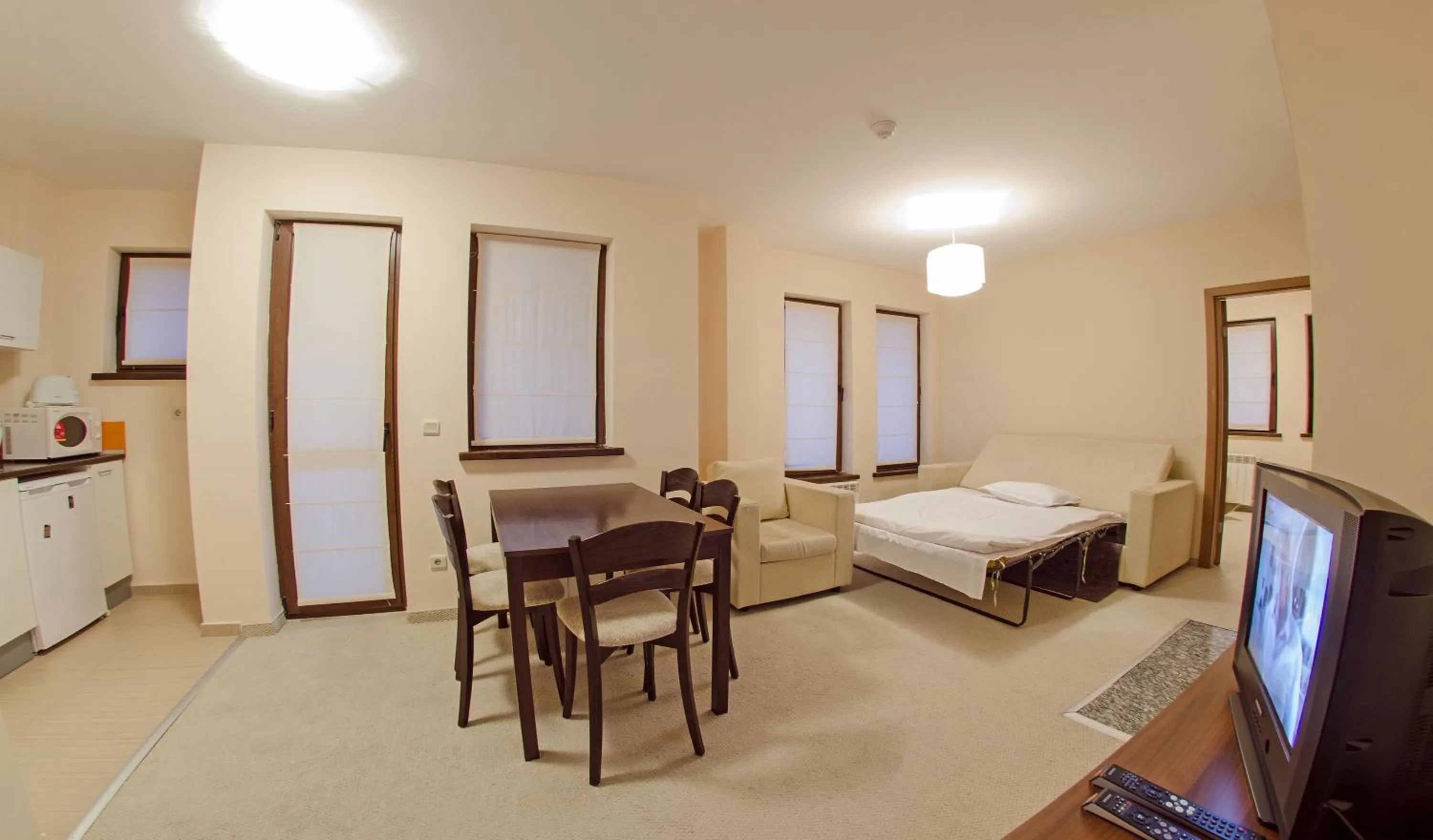 Living room, Bed in Green Life Family Apartments Pamporovo