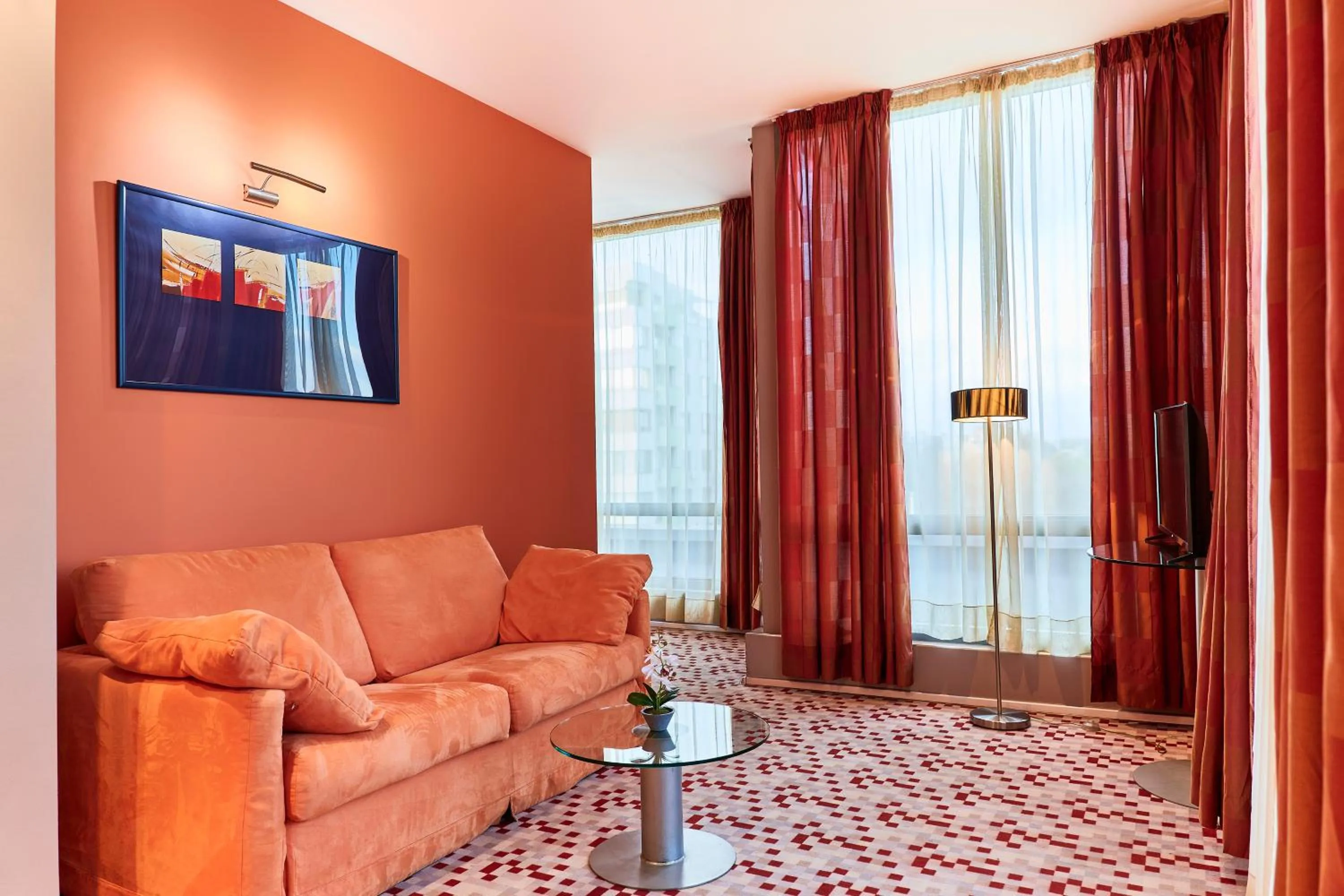 Communal lounge/ TV room in Monet Hotel