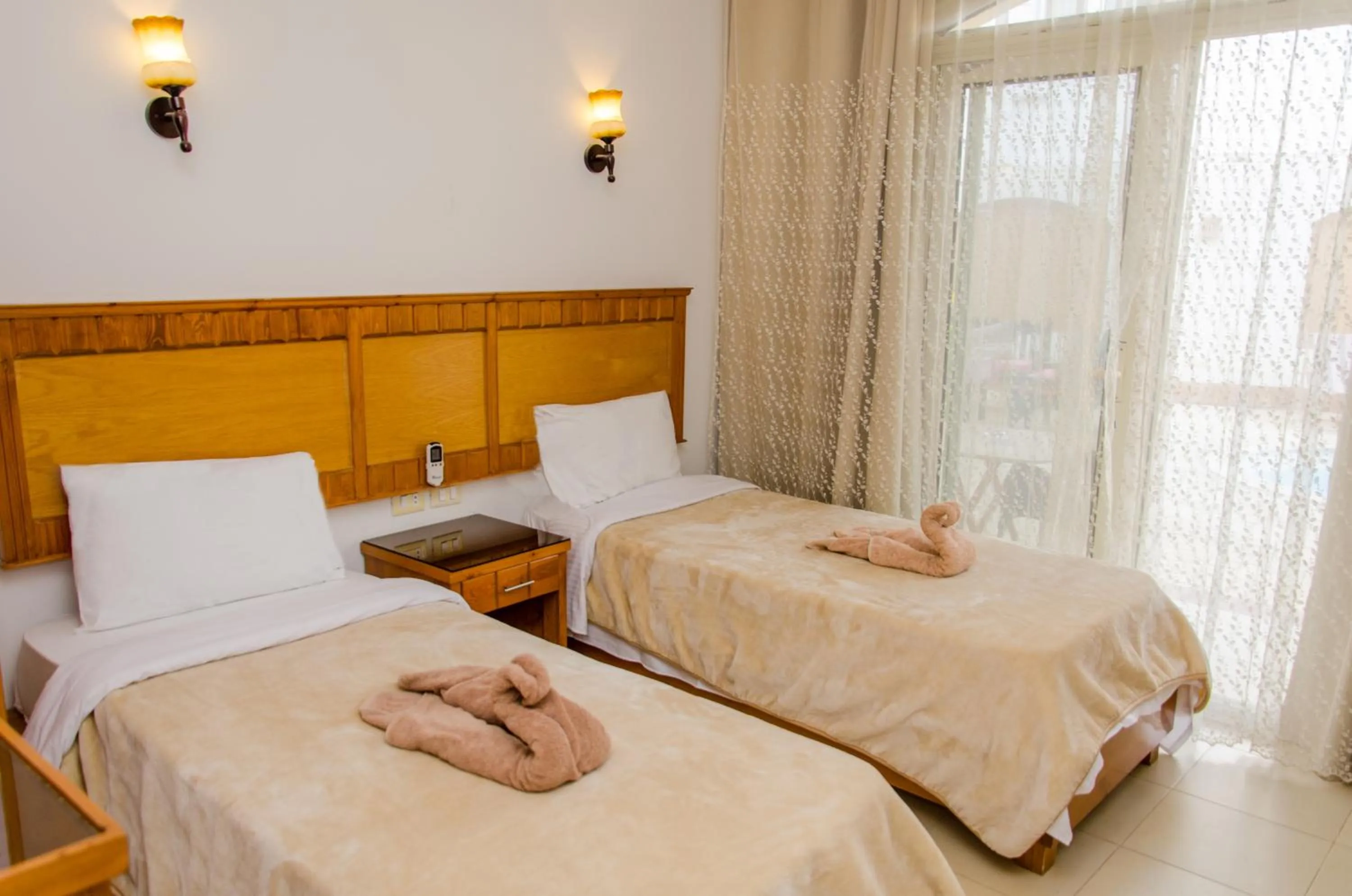 Bed in New Yalla Hotel