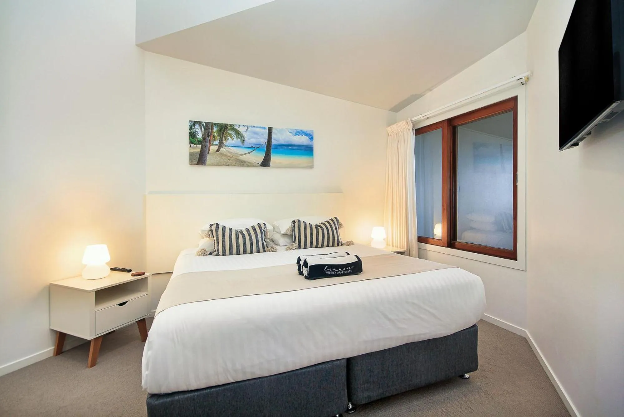 Bed in Lennox Holiday Apartments