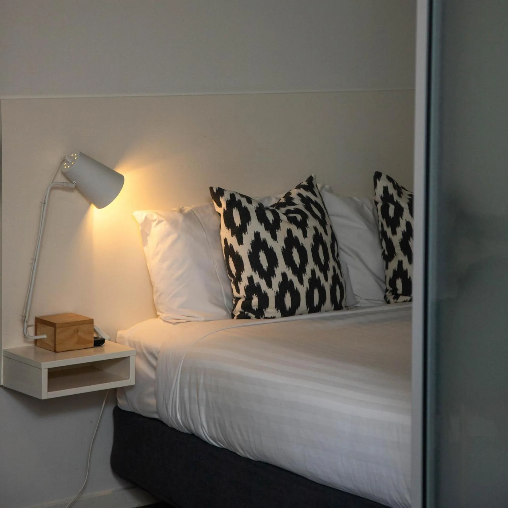 Bed in Lennox Holiday Apartments