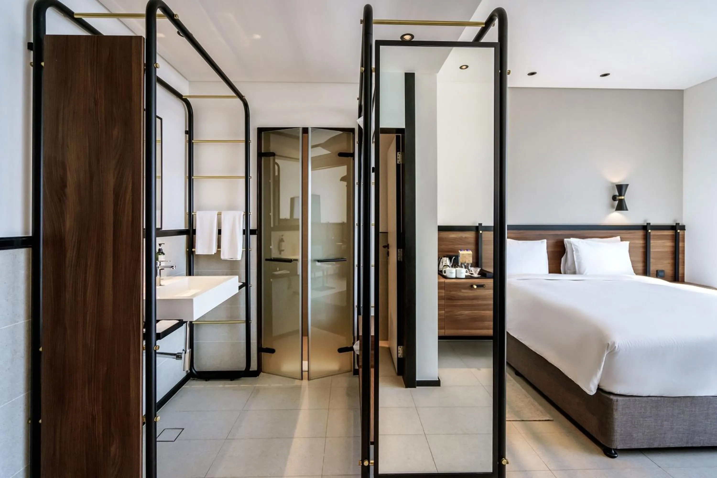 Bathroom, Bed in FORM Hotel Al Jaddaf, Dubai, a Member of Design Hotels