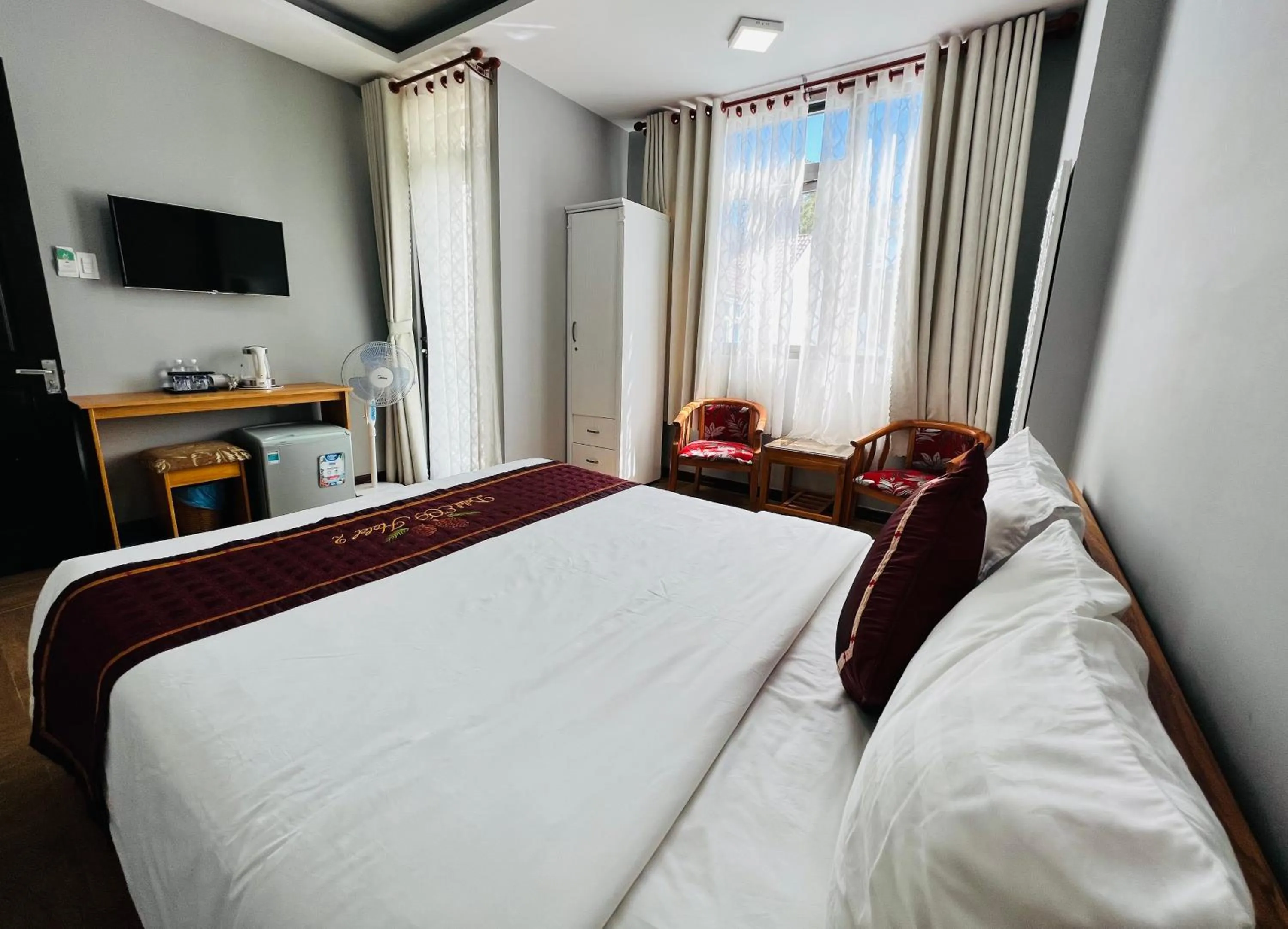 Communal lounge/ TV room, Bed in Dalat ECO Hotel 2