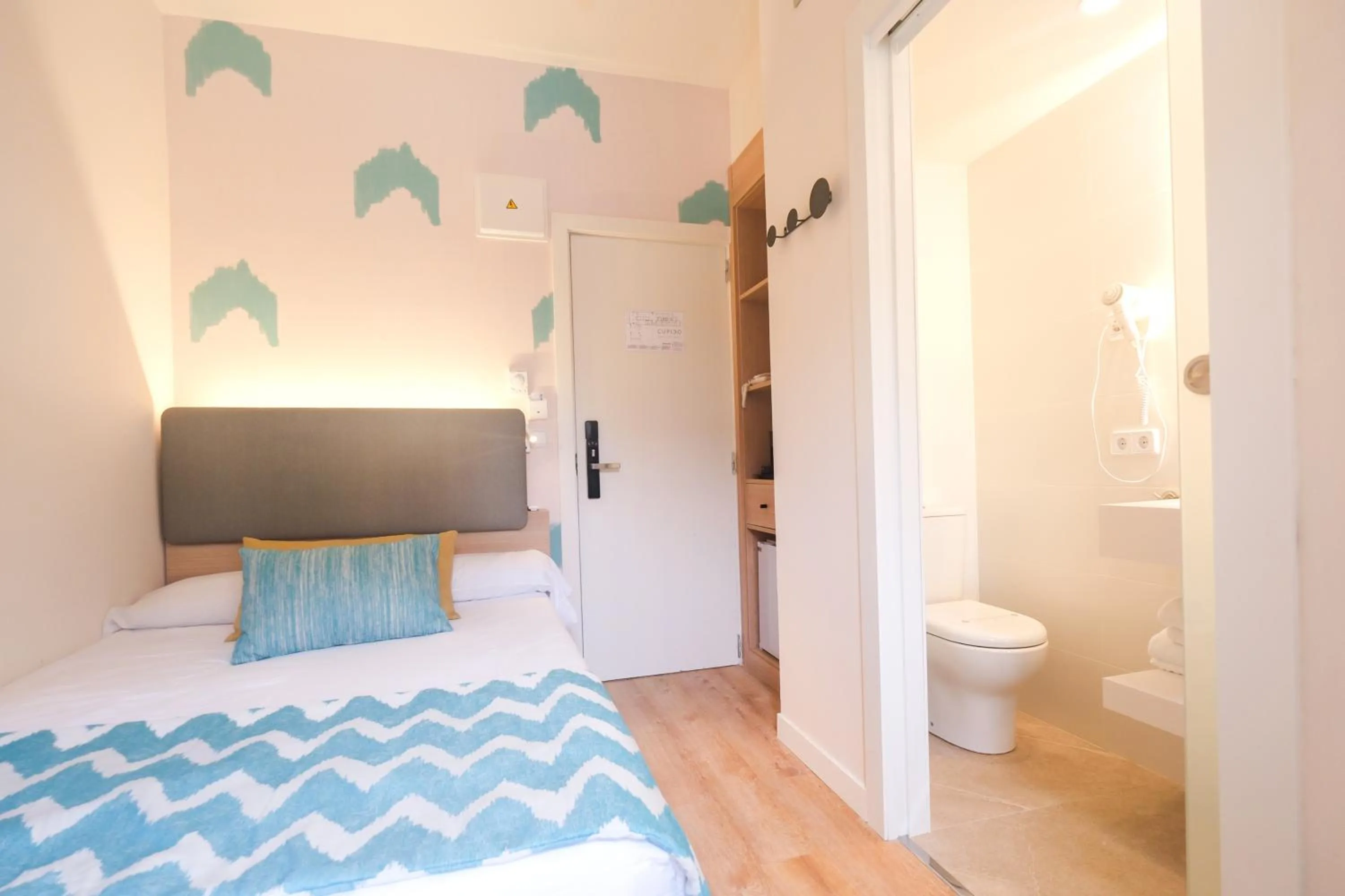 Bed in Cupido Boutique Hotel