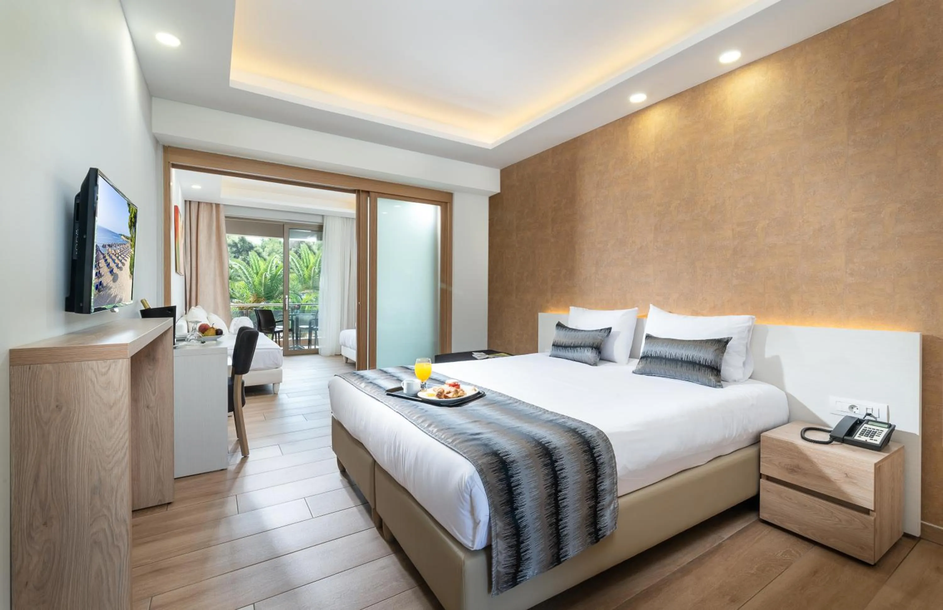 Bed in Poseidon Hotel Sea Resort