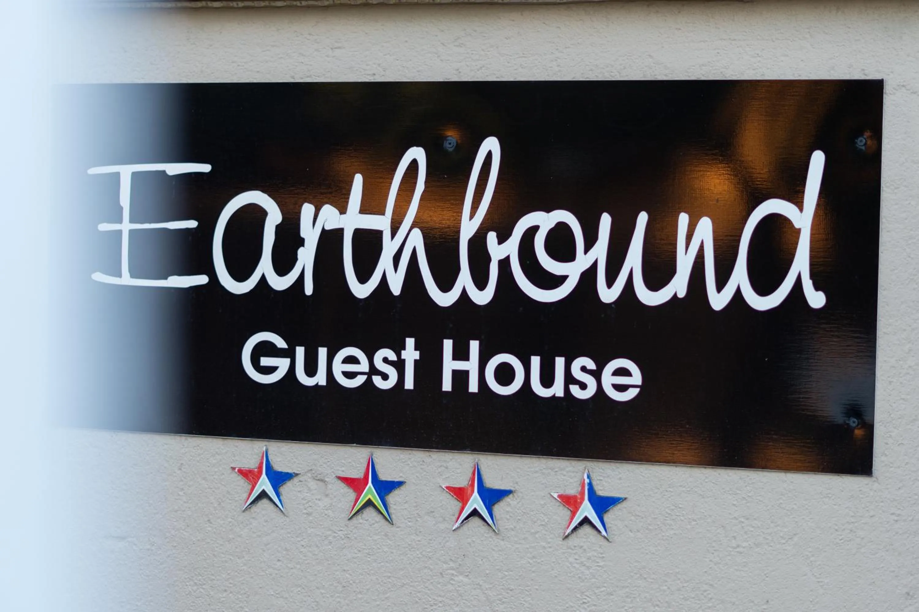 Property logo or sign in Earthbound Guest House