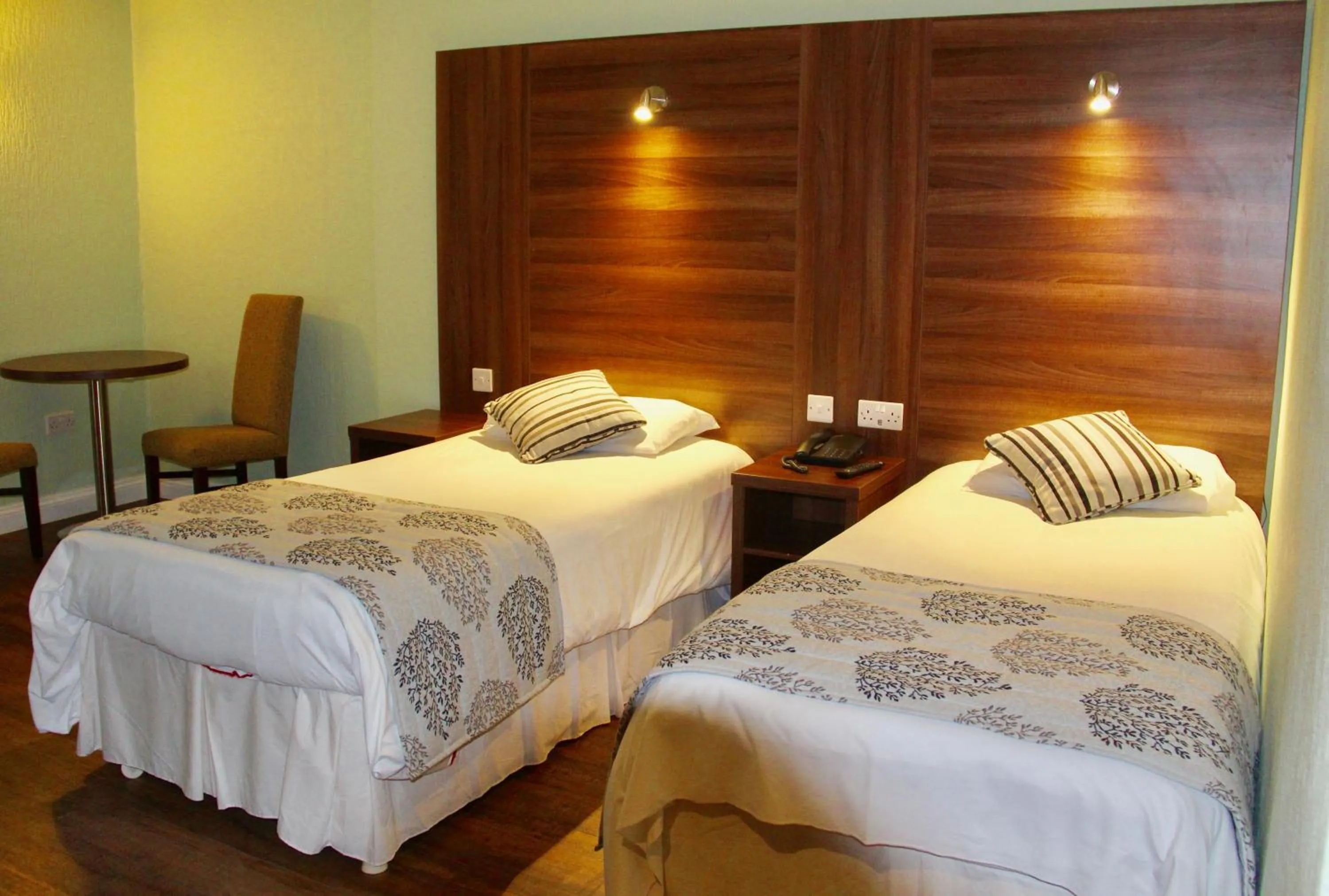 Bed in Oliver Cromwell Hotel