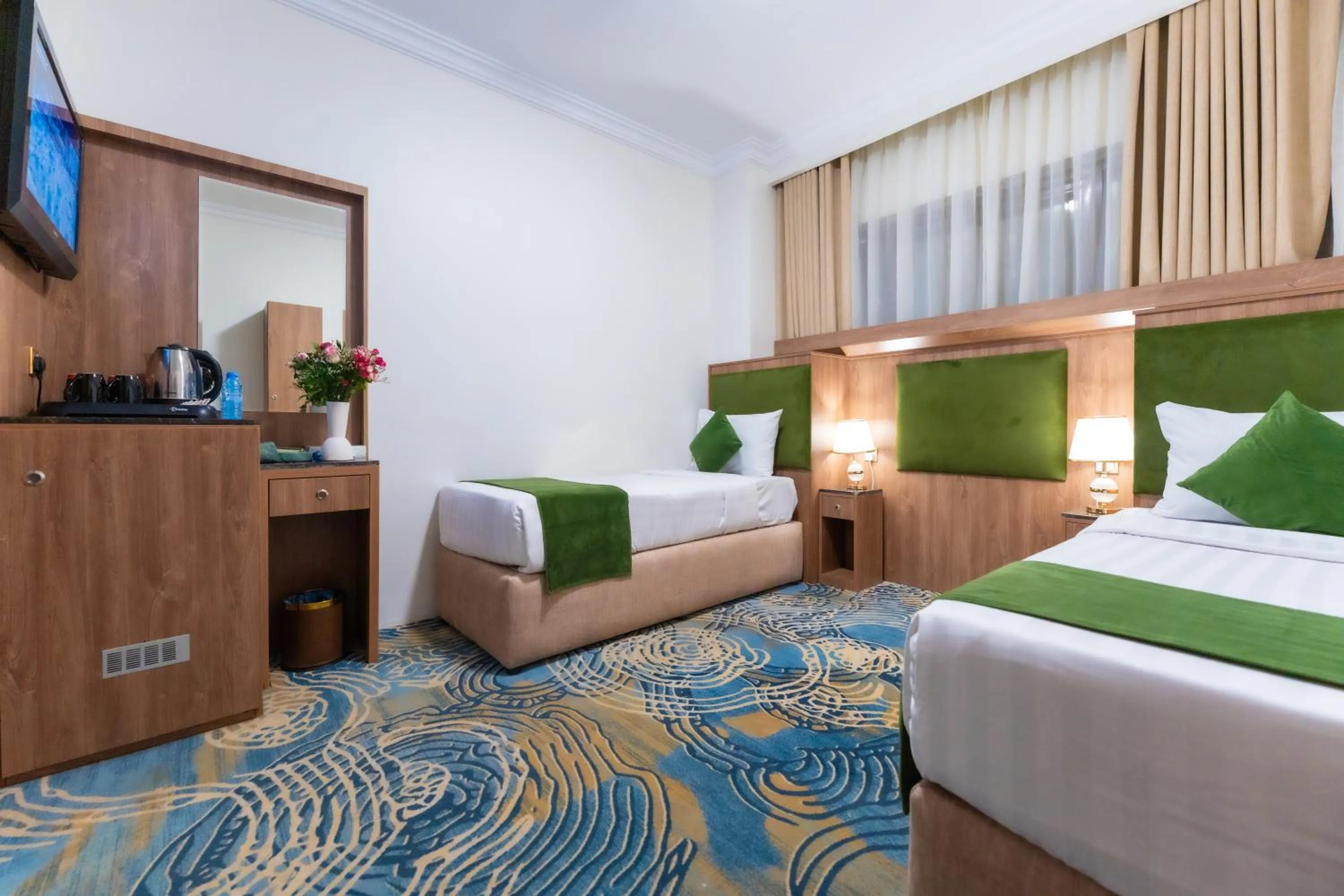 Bed in Hayah Plaza Hotel