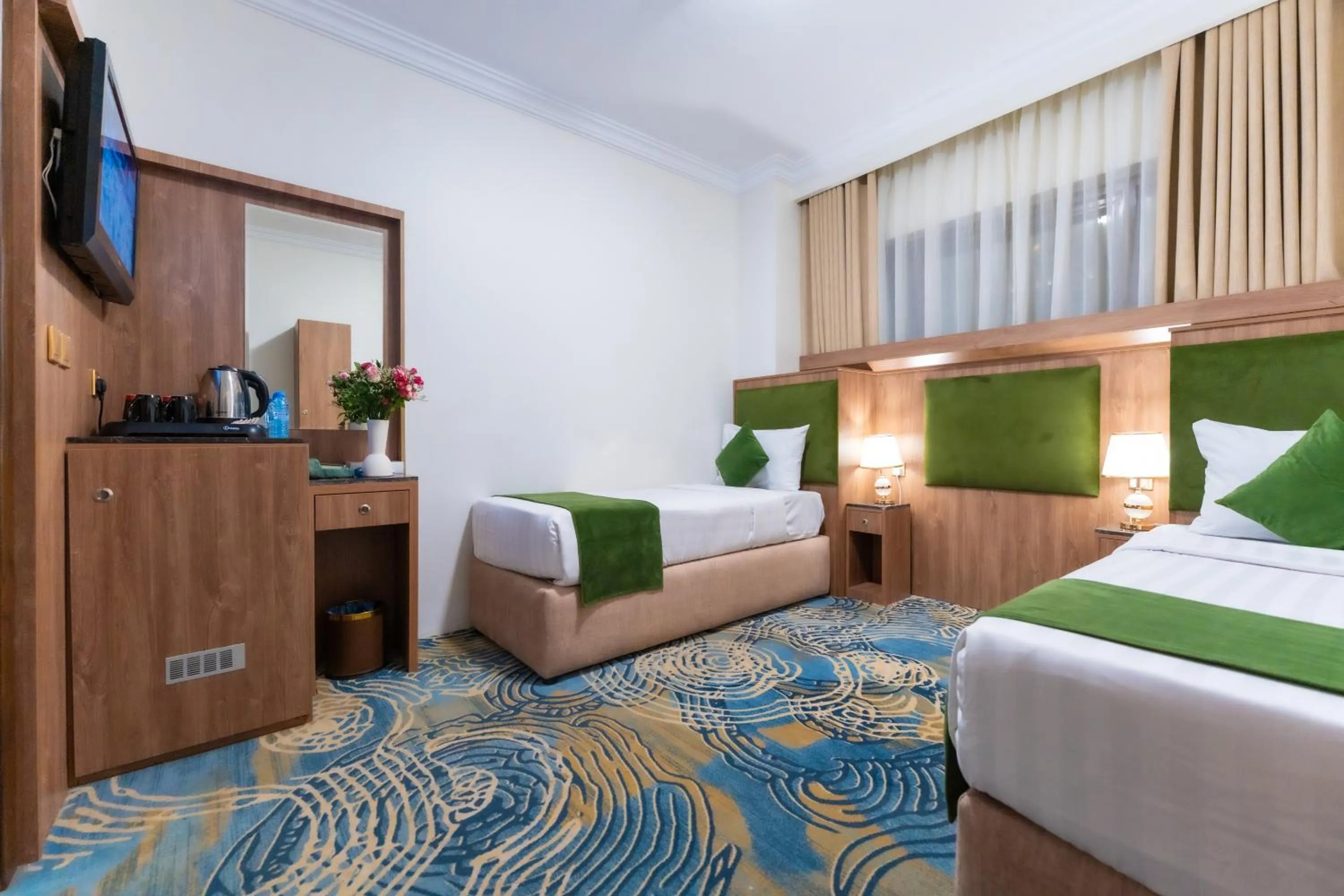 Bed in Hayah Plaza Hotel