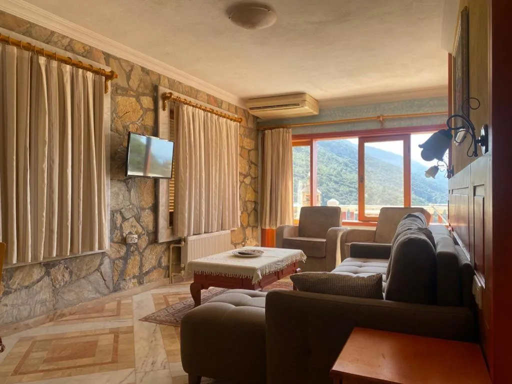 Communal lounge/ TV room in Villa Symbola