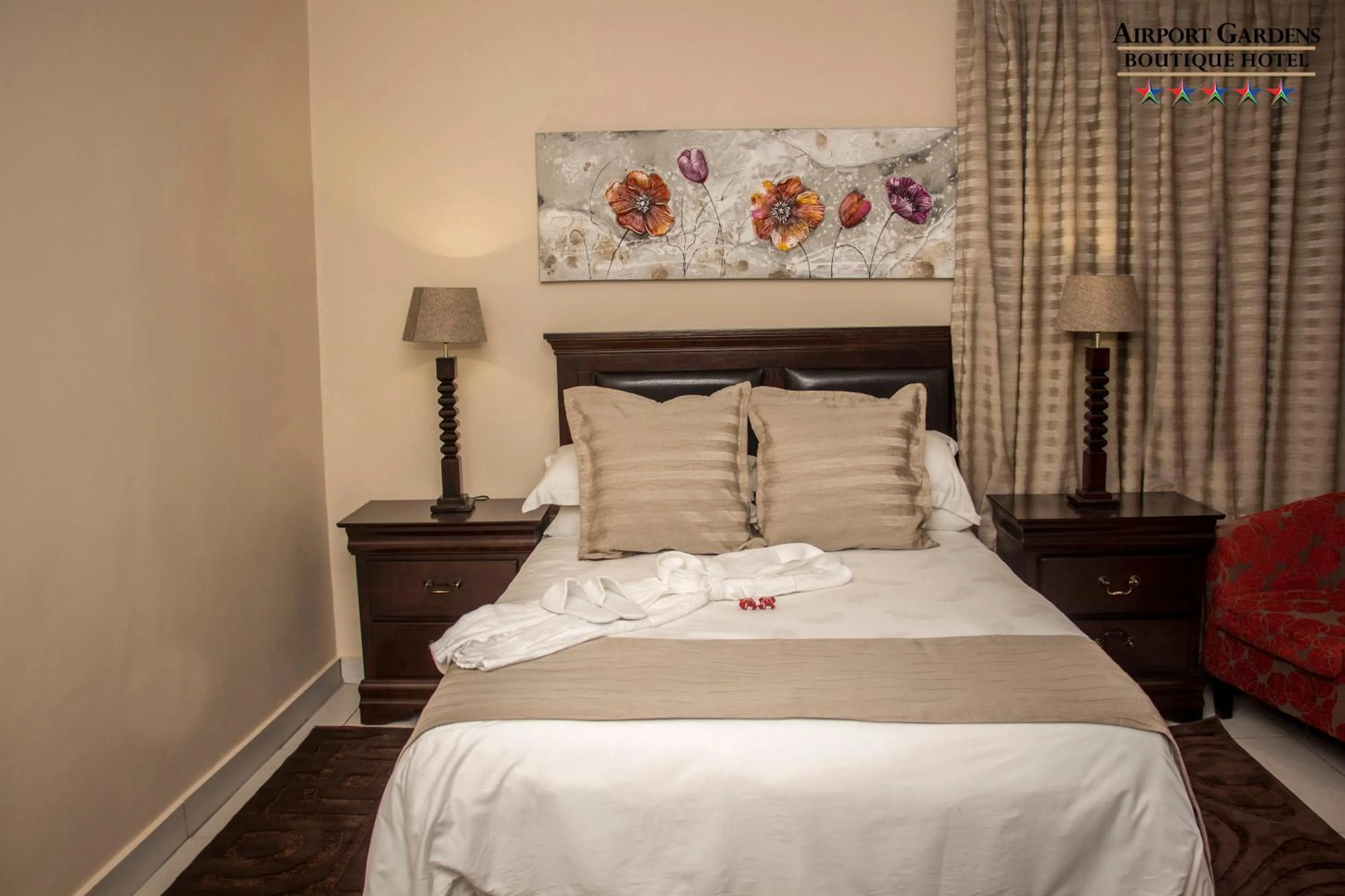 Bed in Airport Gardens Boutique Hotel