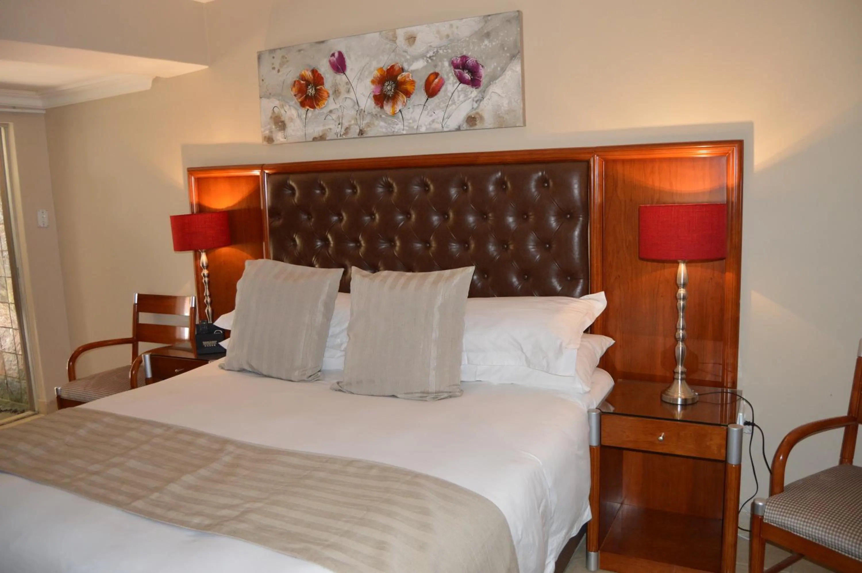 Bed in Airport Gardens Boutique Hotel