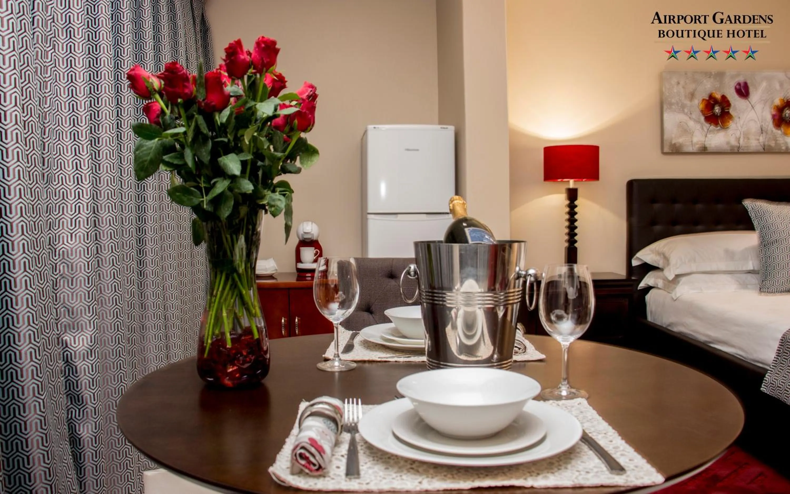 Bed in Airport Gardens Boutique Hotel