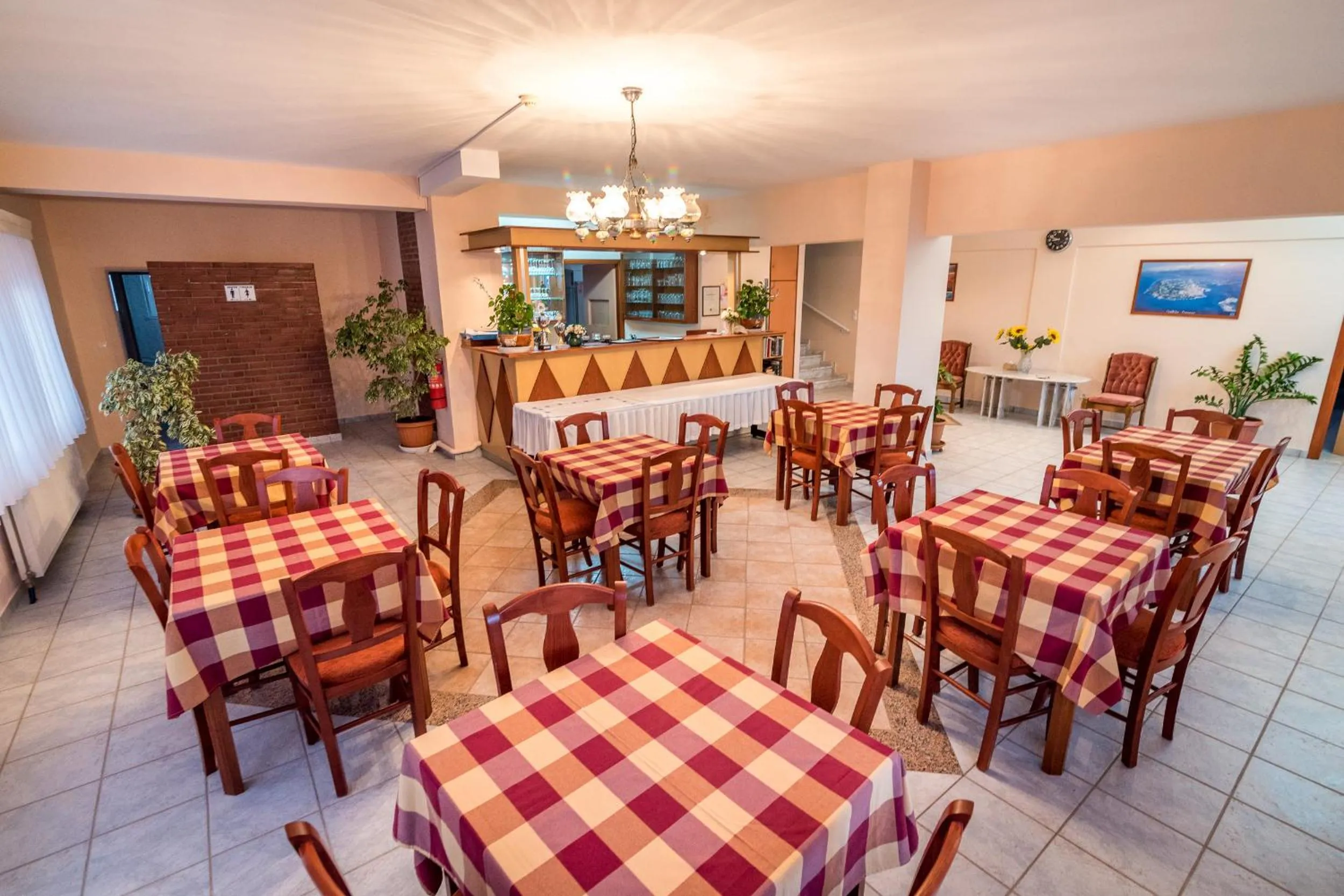 Communal lounge/ TV room in Dionisos Hotel